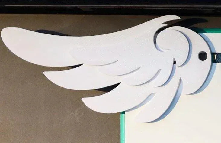 White acrylic wing-shaped car mirror charm with layered feather design for gamers