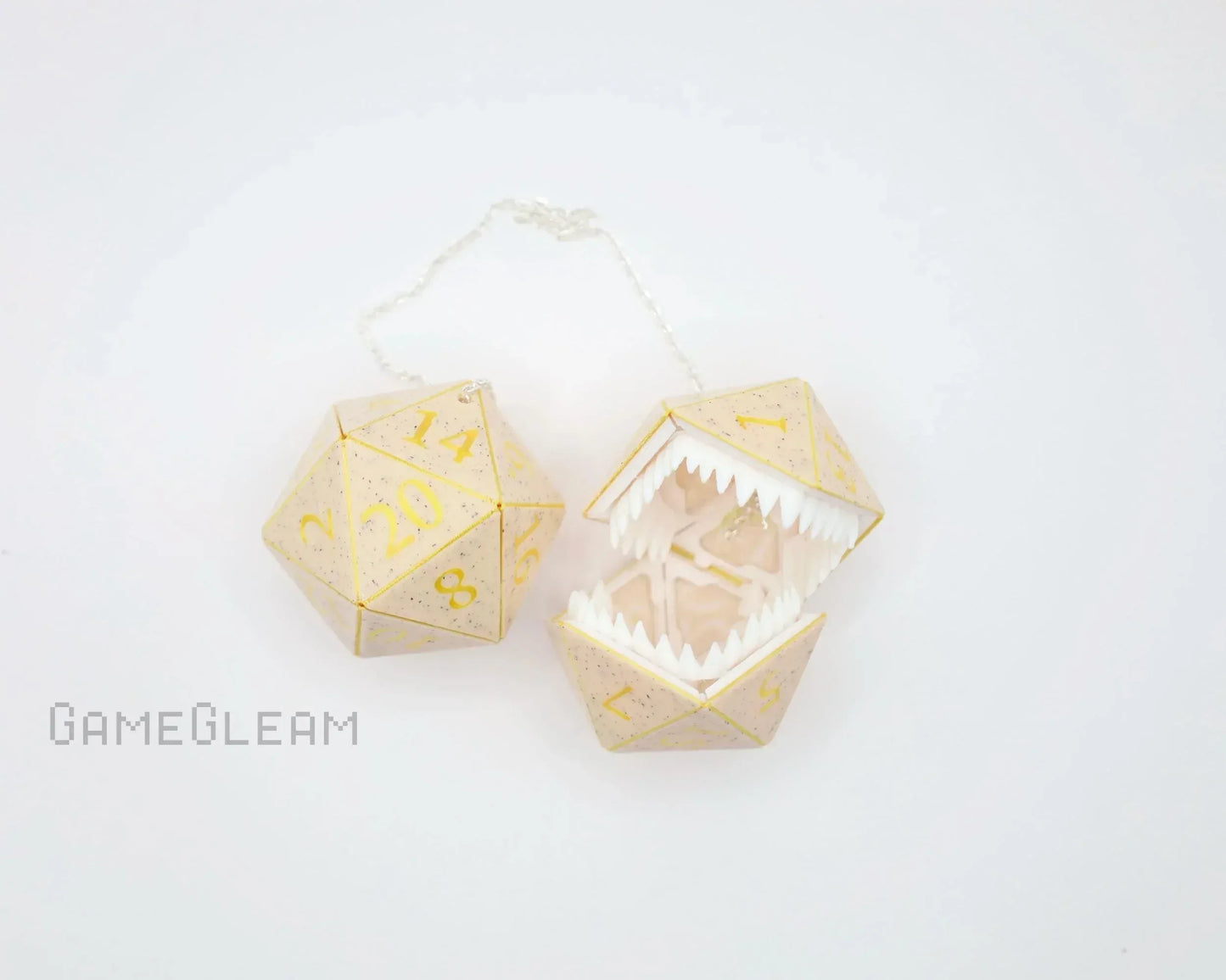 Handmade gold-speckled D20 dice charm with hinged monster mouth, geek gift accessory.