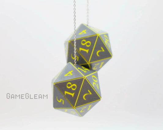 Pair of holographic twenty-sided dice car charms with yellow numbers on silver chain