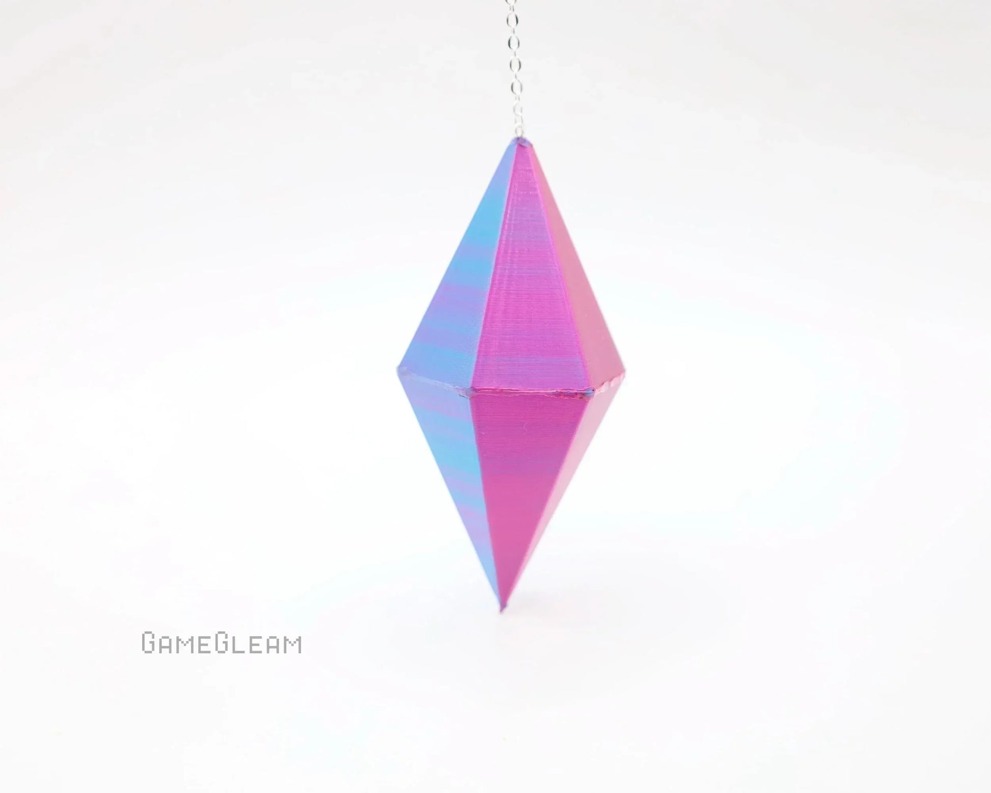 Holographic pink and blue geometric hanging charm with chain on white background