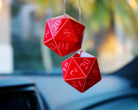 Red 20-sided dice car charm hanging on a chain, perfect for tabletop RPG fans.