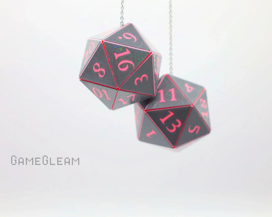 Holographic black and pink 20-sided dice car charm hanging on a chain