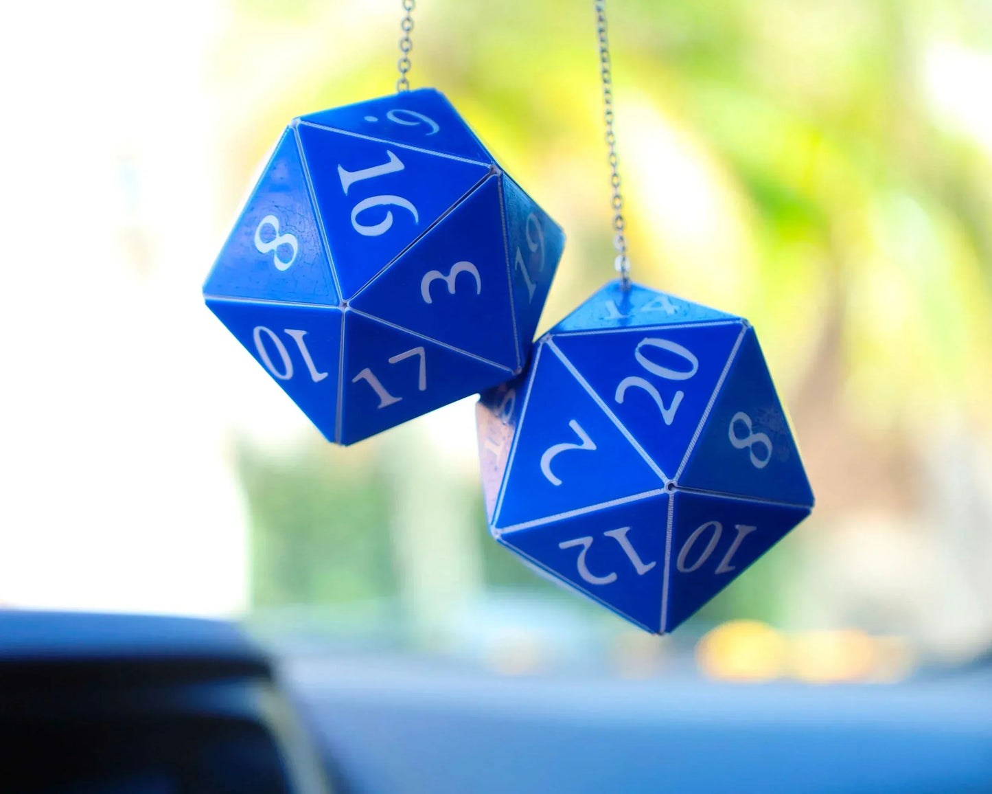 Blue twenty-sided dice hanging as car mirror charms, gamer gift accessory