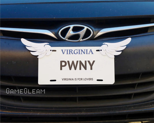 Novelty Virginia license plate with PWNY text and attached white wing decorations on a car grill