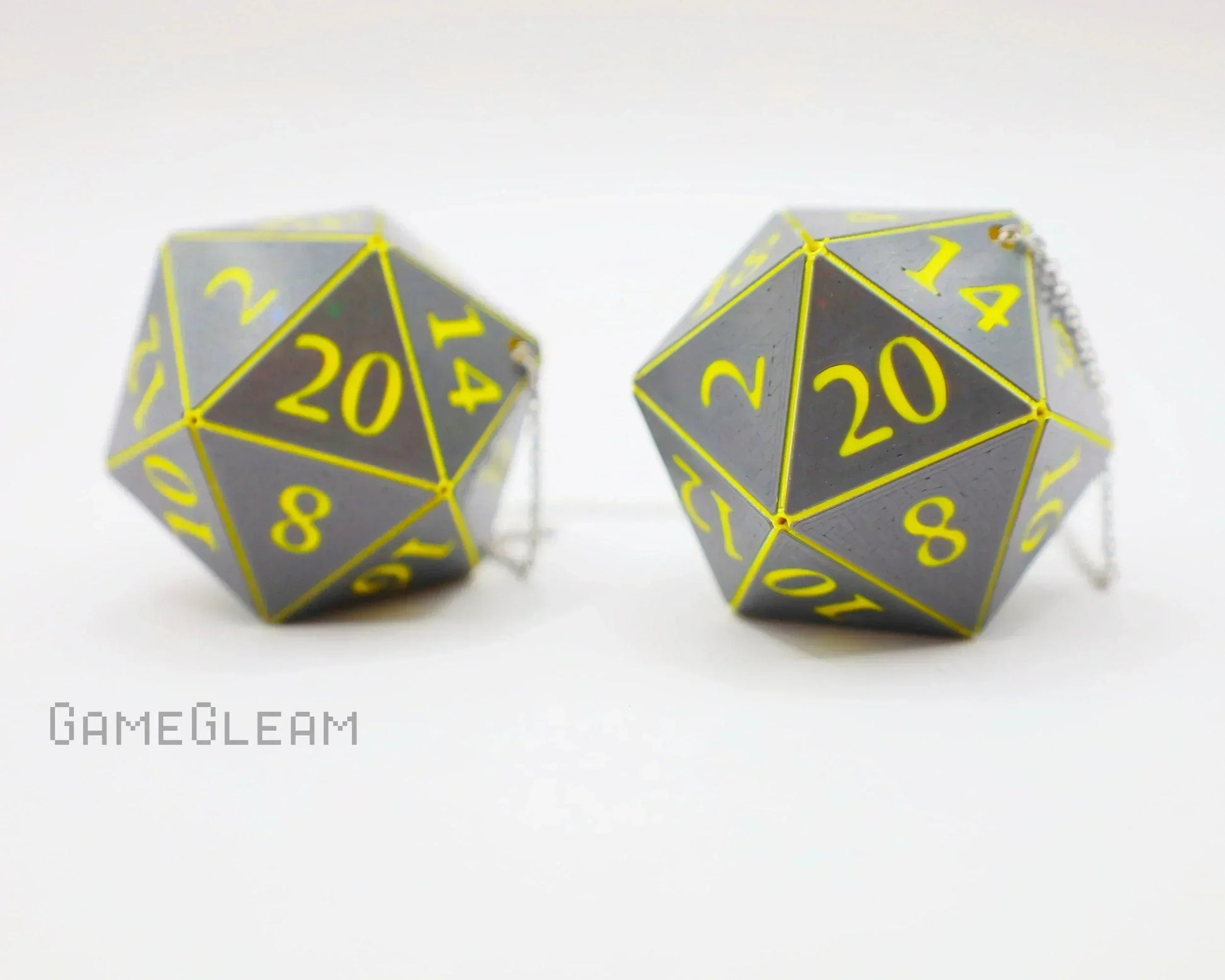 Pair of large gray twenty-sided dice with yellow numbers and chains, gamer car accessory gift