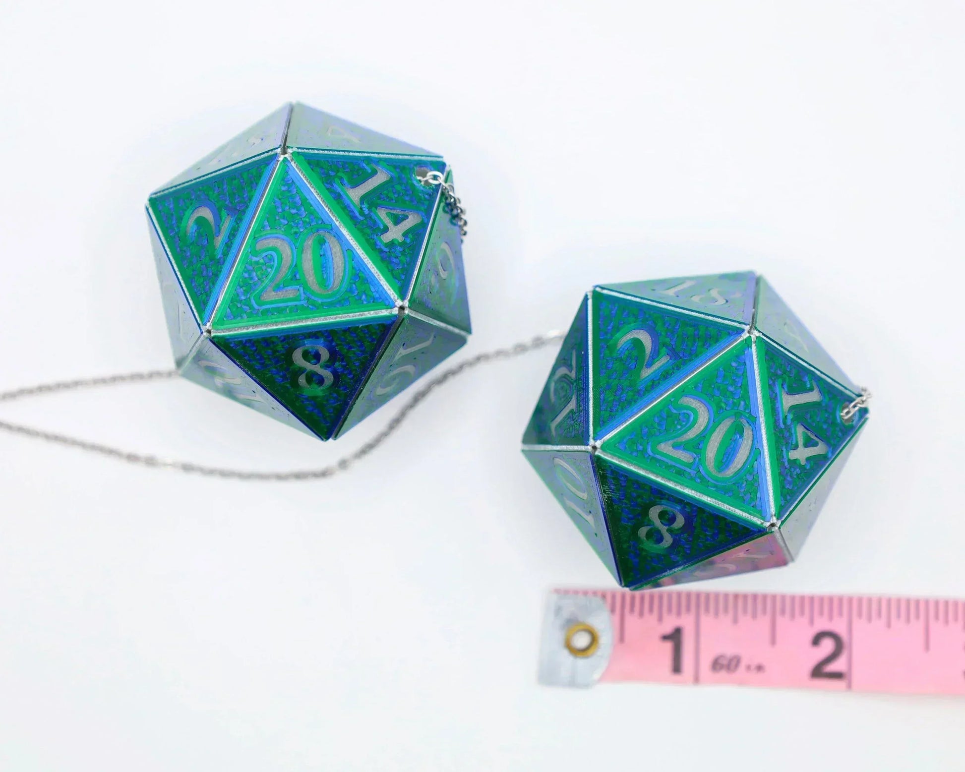 Holographic green and blue twenty-sided dice charms with chain and measuring tape