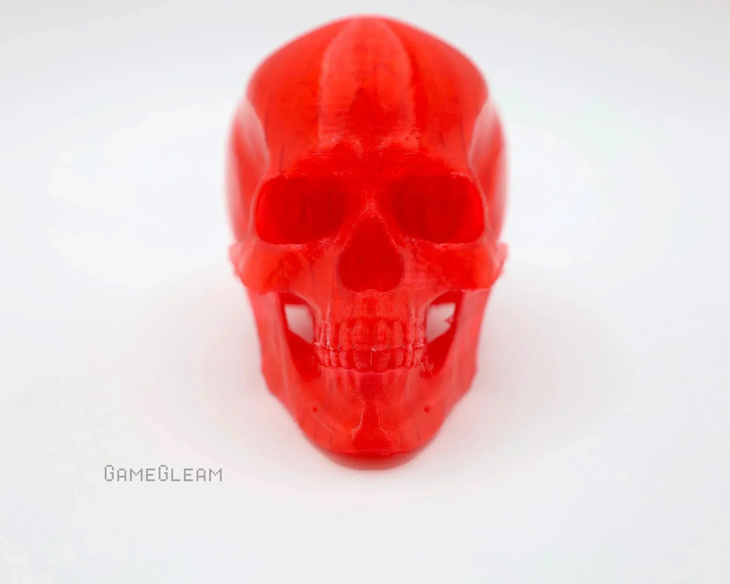Handmade translucent red skull figurine for tabletop gaming decor, front view