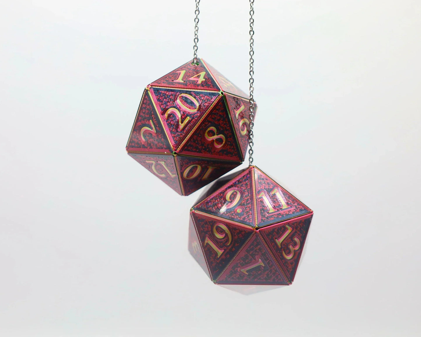 Holographic red 20-sided dice car charm with gold numbers, hanging on a chain.