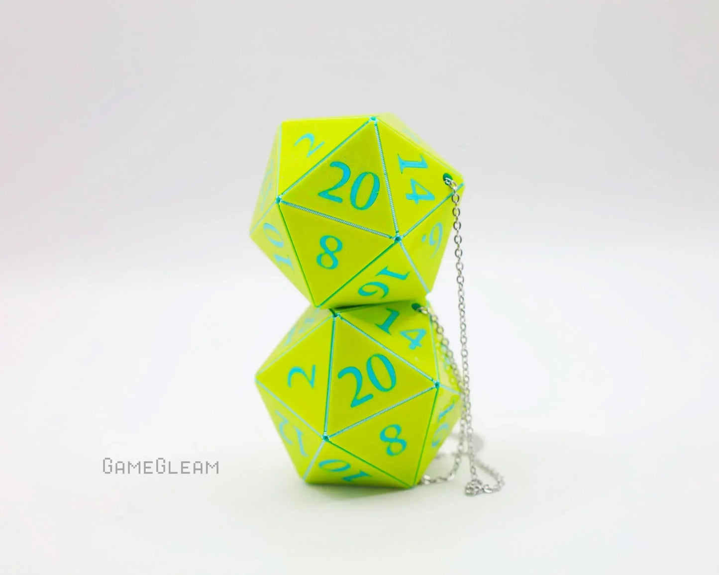 Neon green twenty-sided dice car charm with blue numbers and a silver chain on white background.