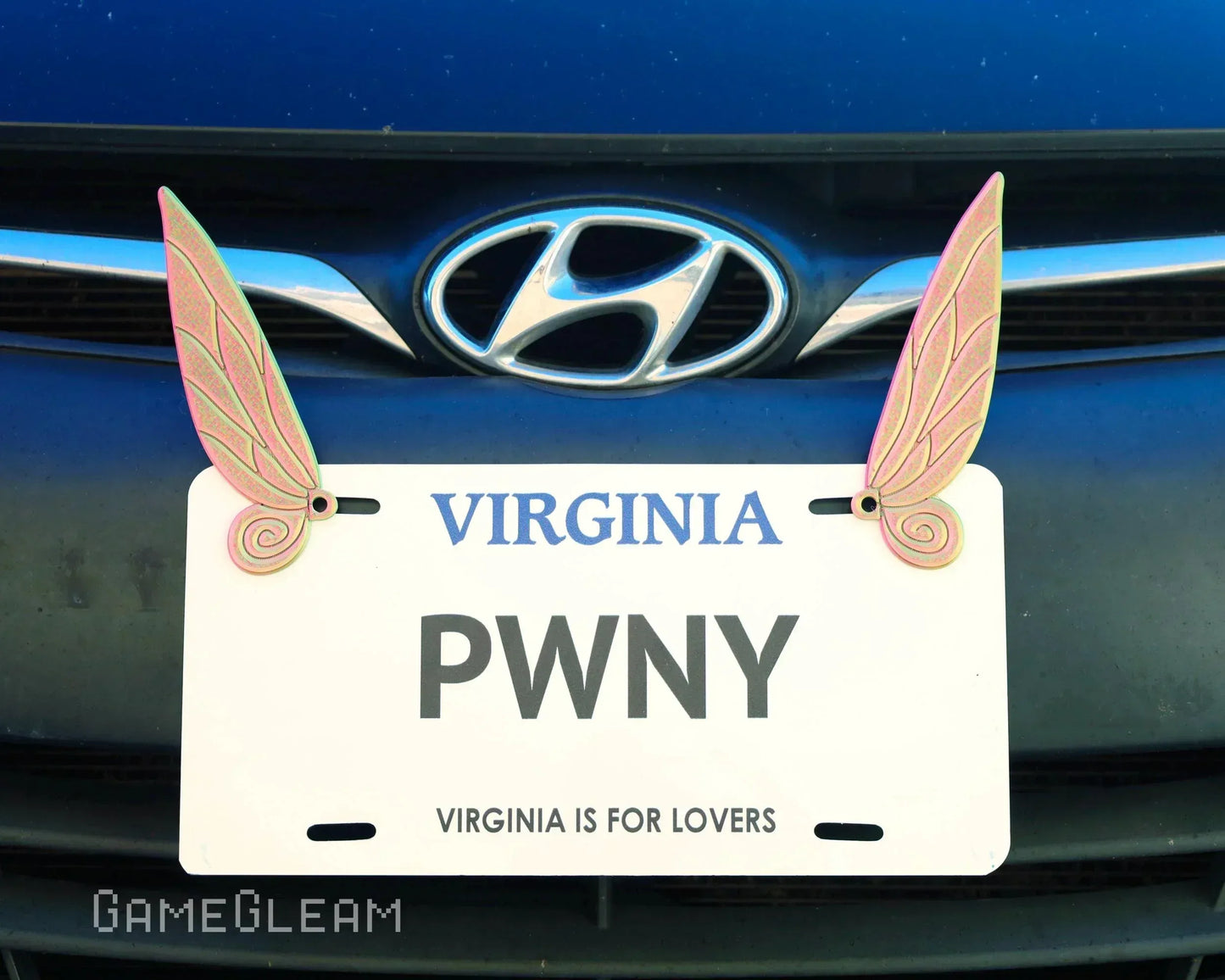 Car license plate frame with iridescent fairy wings on a Hyundai vehicle