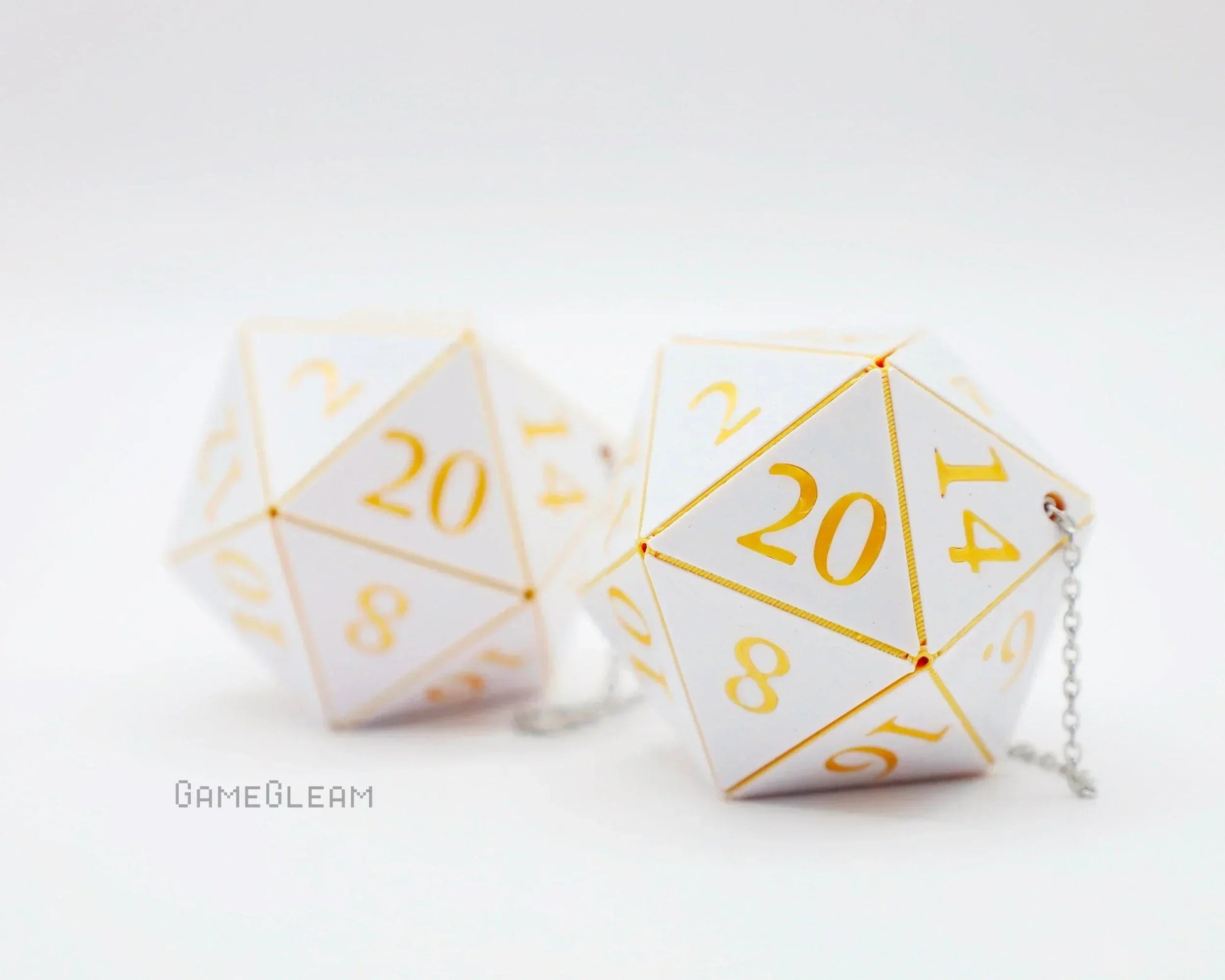 White 20-sided dice with gold numbers and chain, gamer car accessory gift