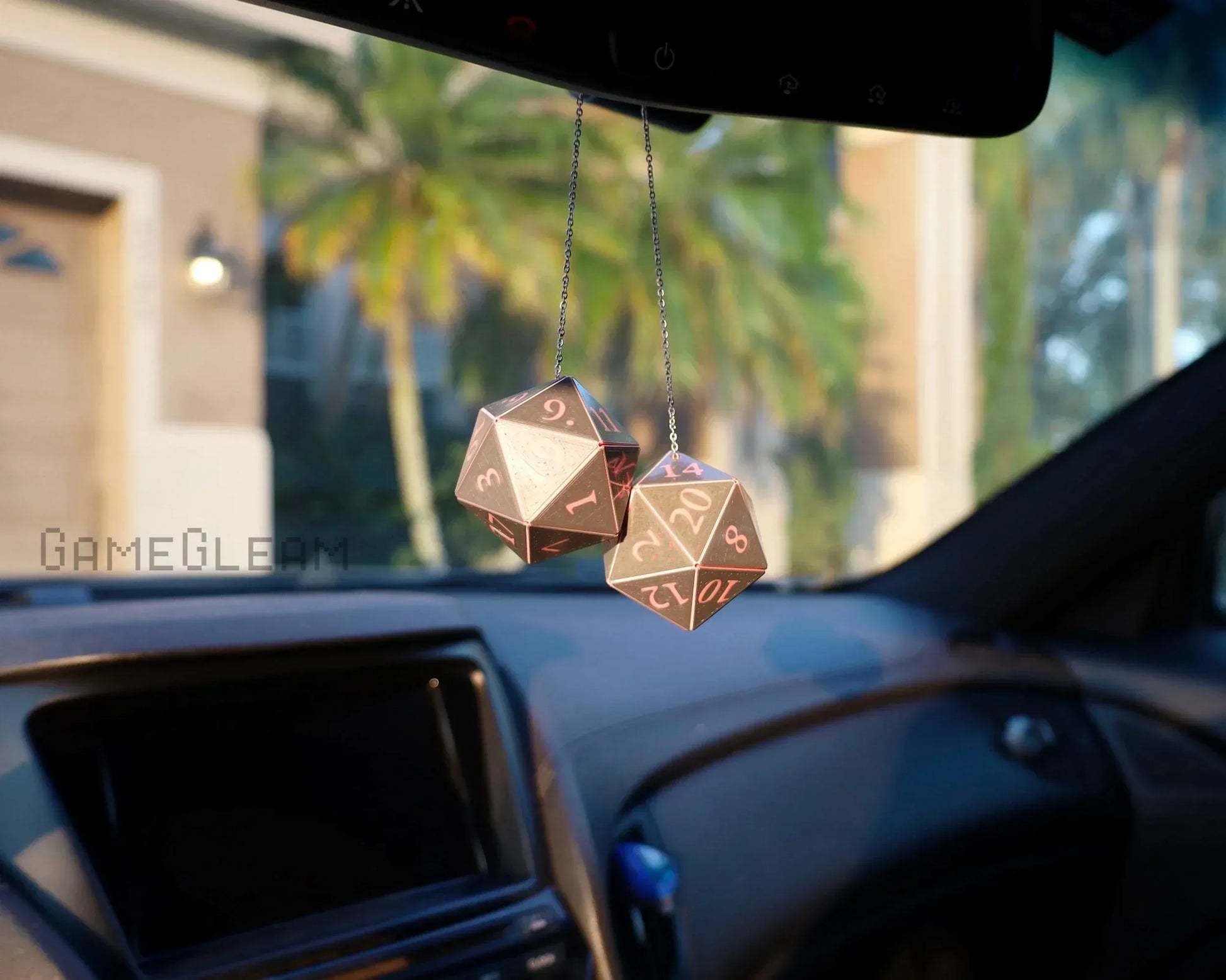 Metallic twenty-sided dice car mirror charm for tabletop gaming enthusiasts hanging in vehicle