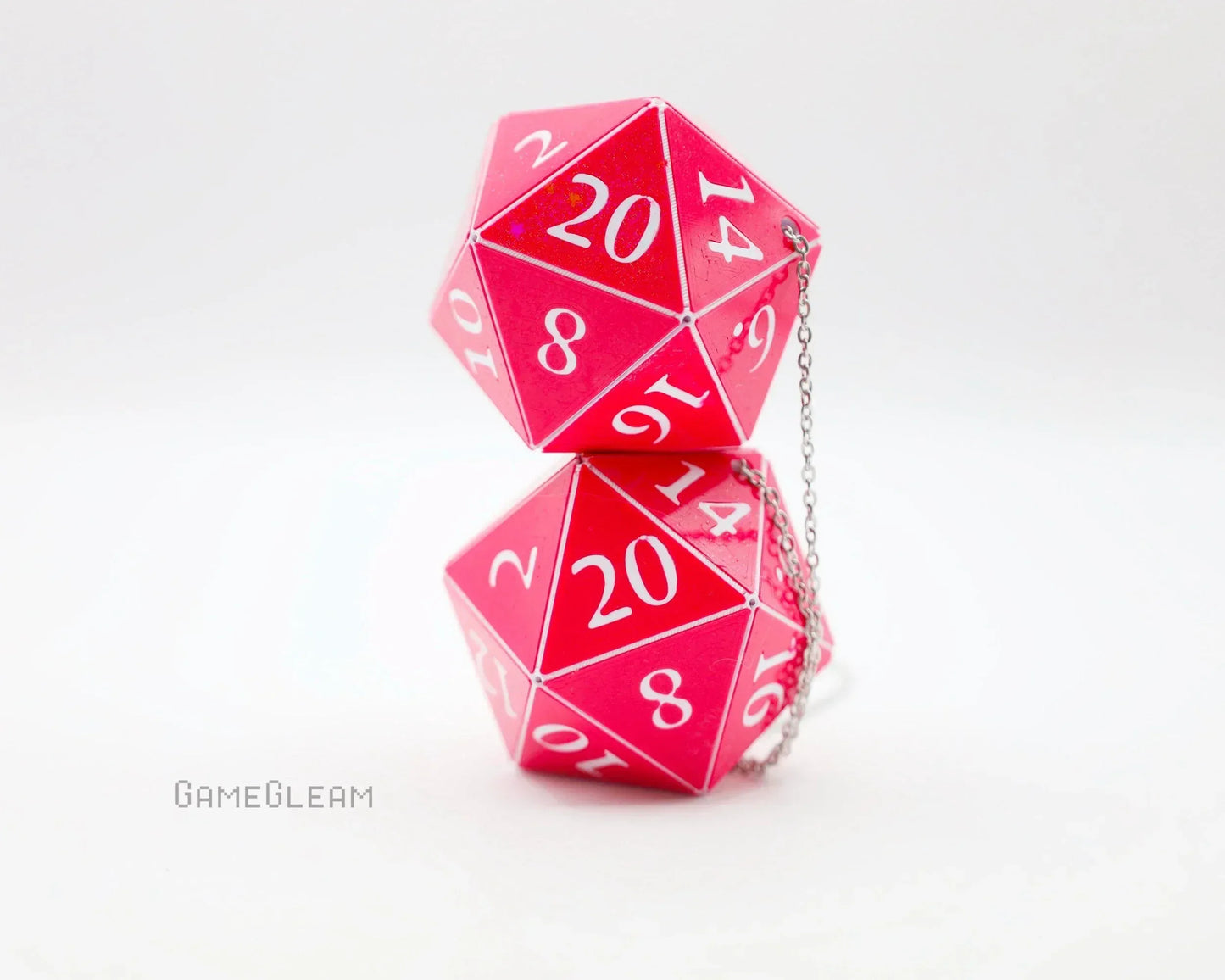 Pink holographic twenty-sided dice car charm with silver chain on a white background