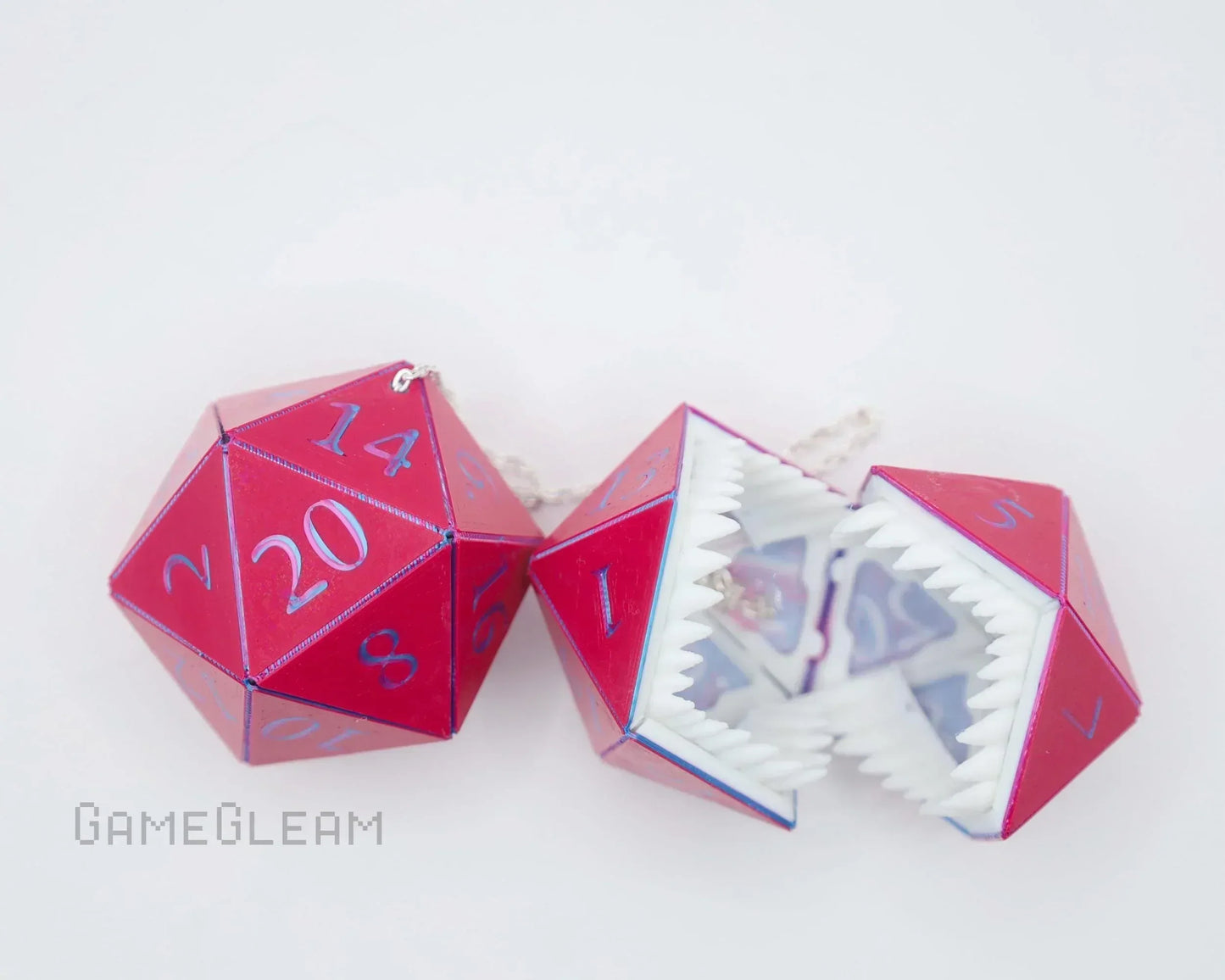 Red twenty-sided dice charms, one with monster teeth, for gamer car or home decor