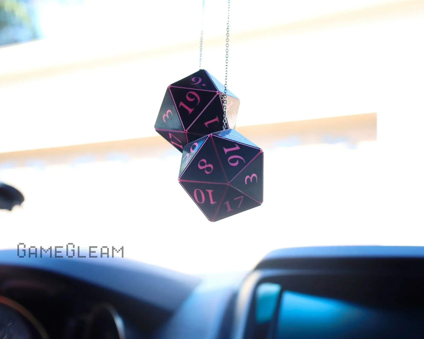Hanging holographic black and pink twenty-sided dice car charm for RPG enthusiasts