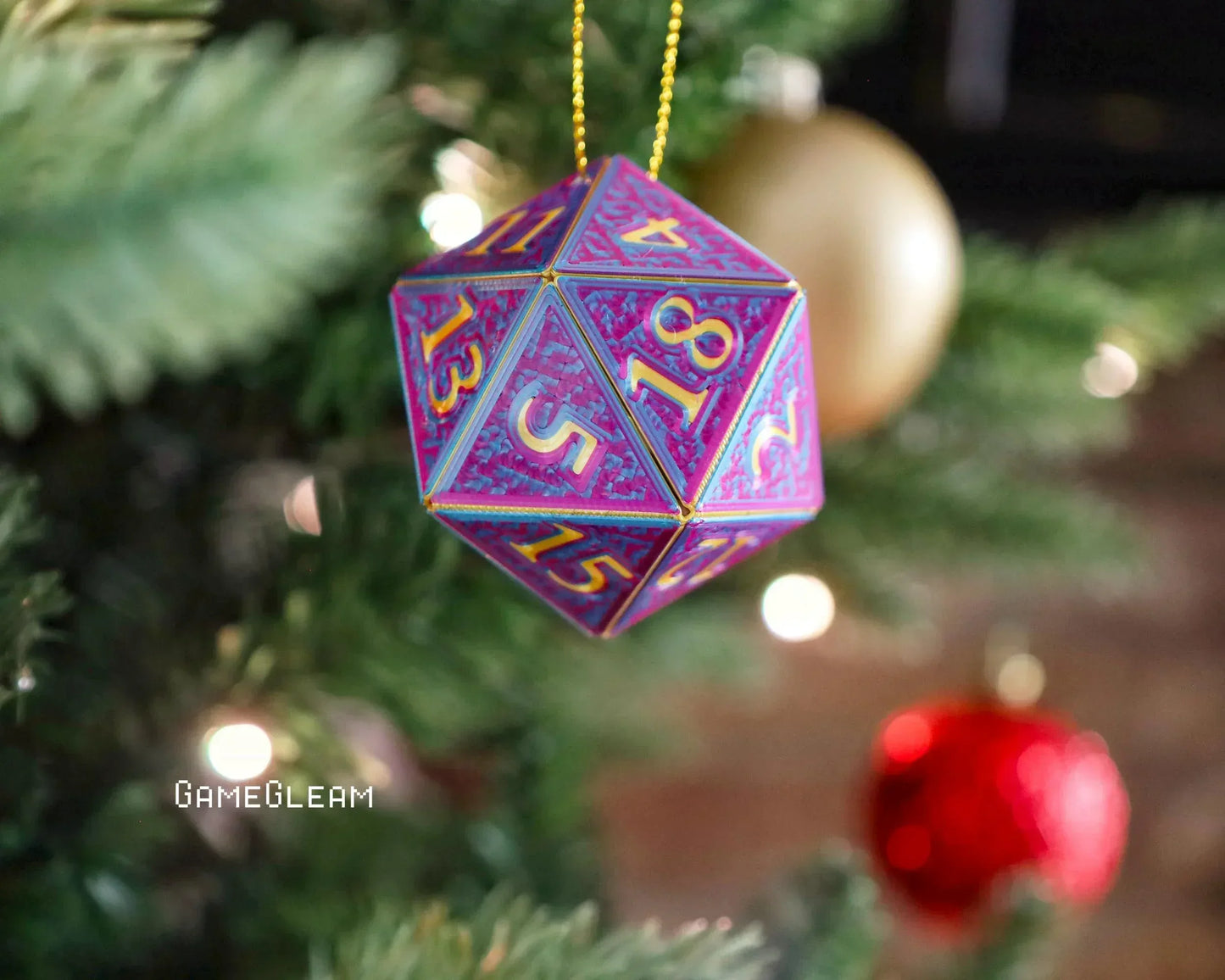 Purple holographic twenty-sided dice ornament hanging on a Christmas tree branch