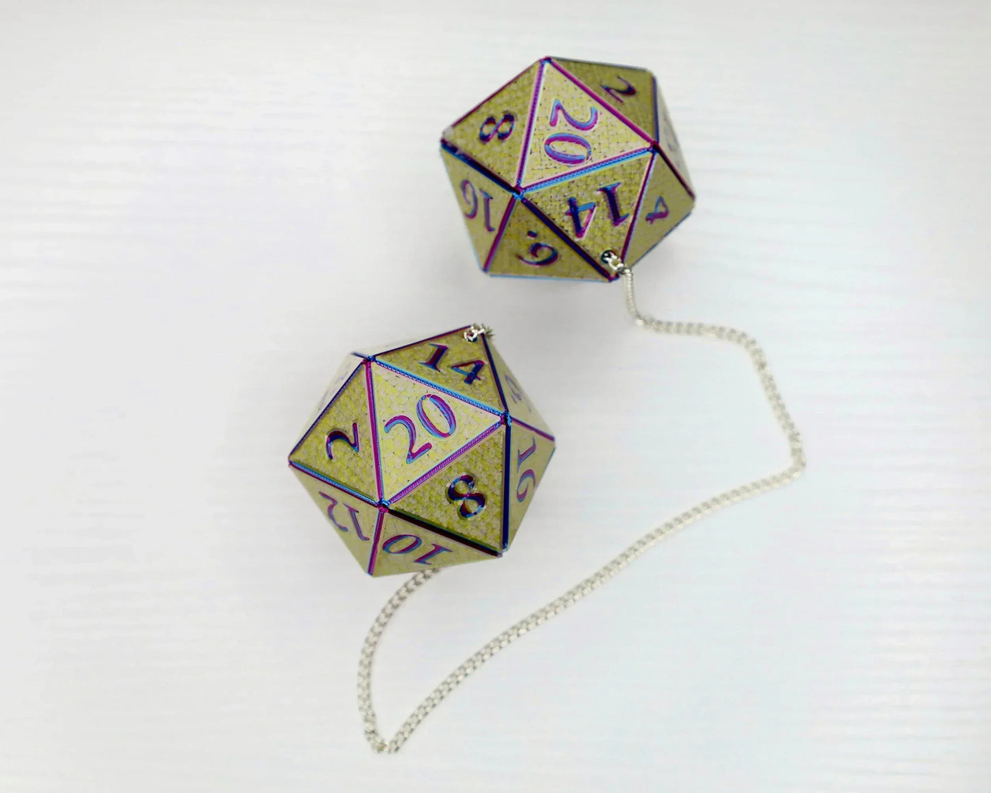 Holographic gold D20 dice car charm on a silver chain for tabletop RPG fans