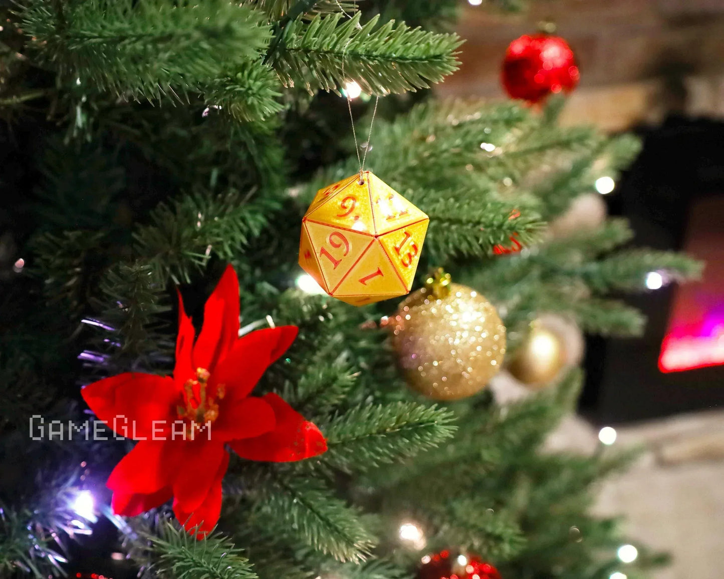 Yellow gaming dice ornament hanging on Christmas tree with red and gold decorations