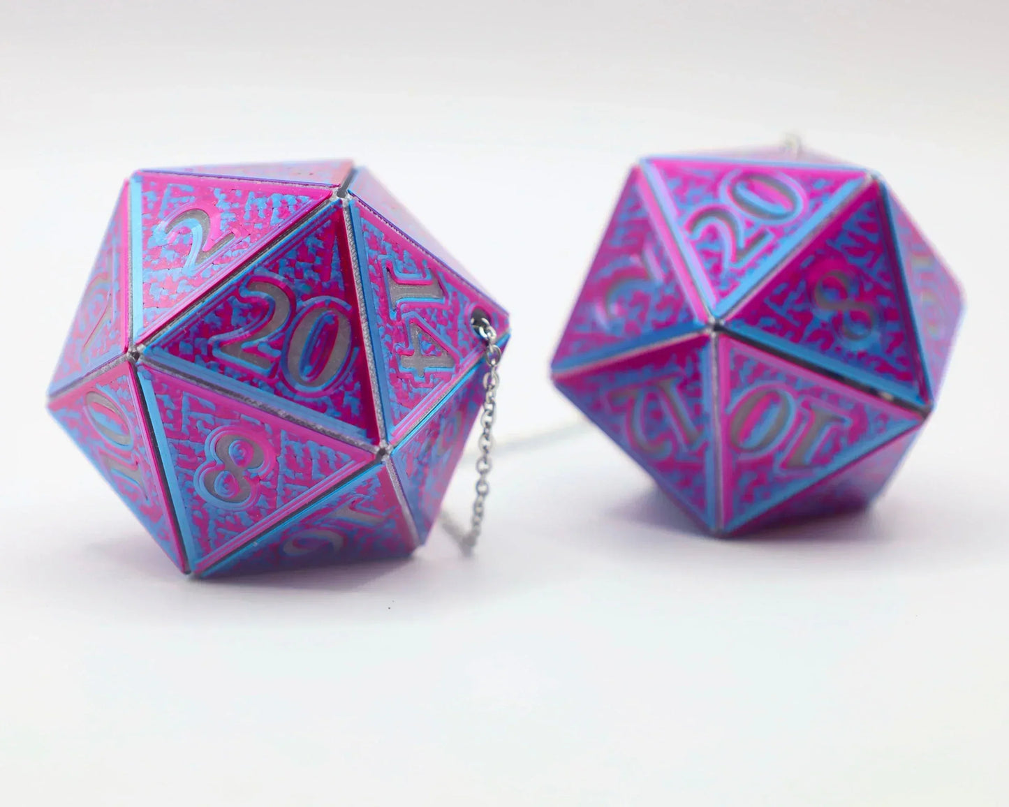 Holographic pink and blue metal 20-sided dice car charms for tabletop RPG fans