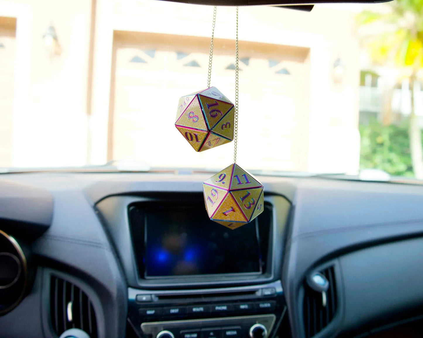 Holographic twenty-sided dice car hanging charm in a car interior for tabletop gamers