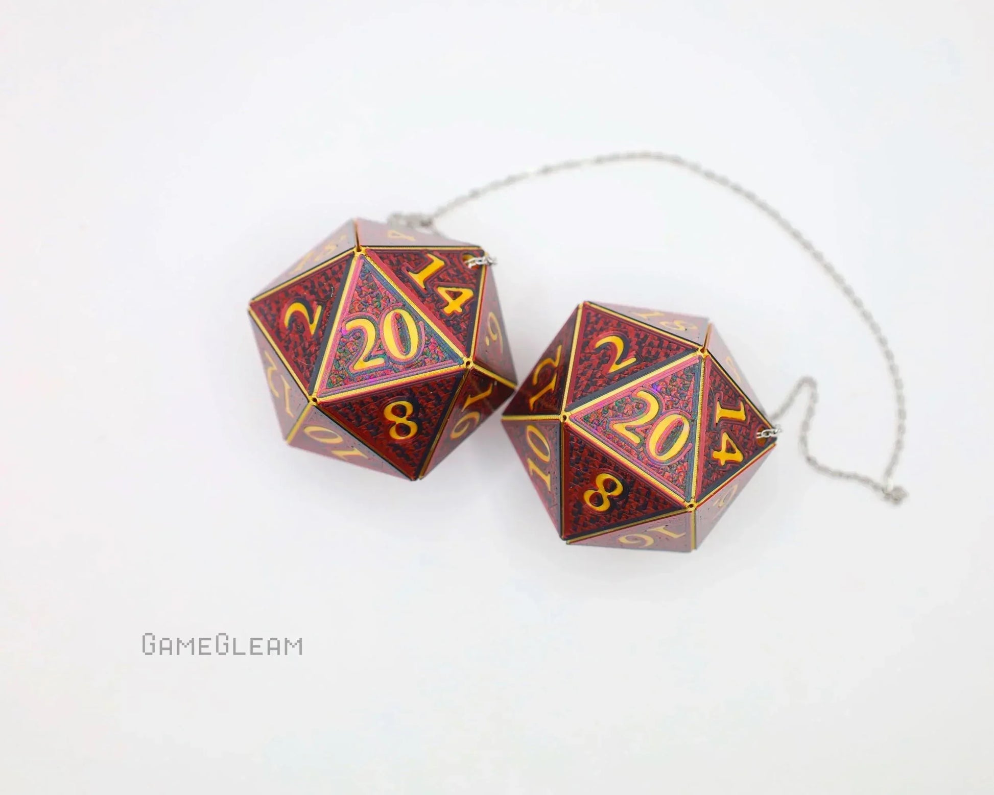 Pair of holographic red 20-sided dice car charms with gold numbers on a chain