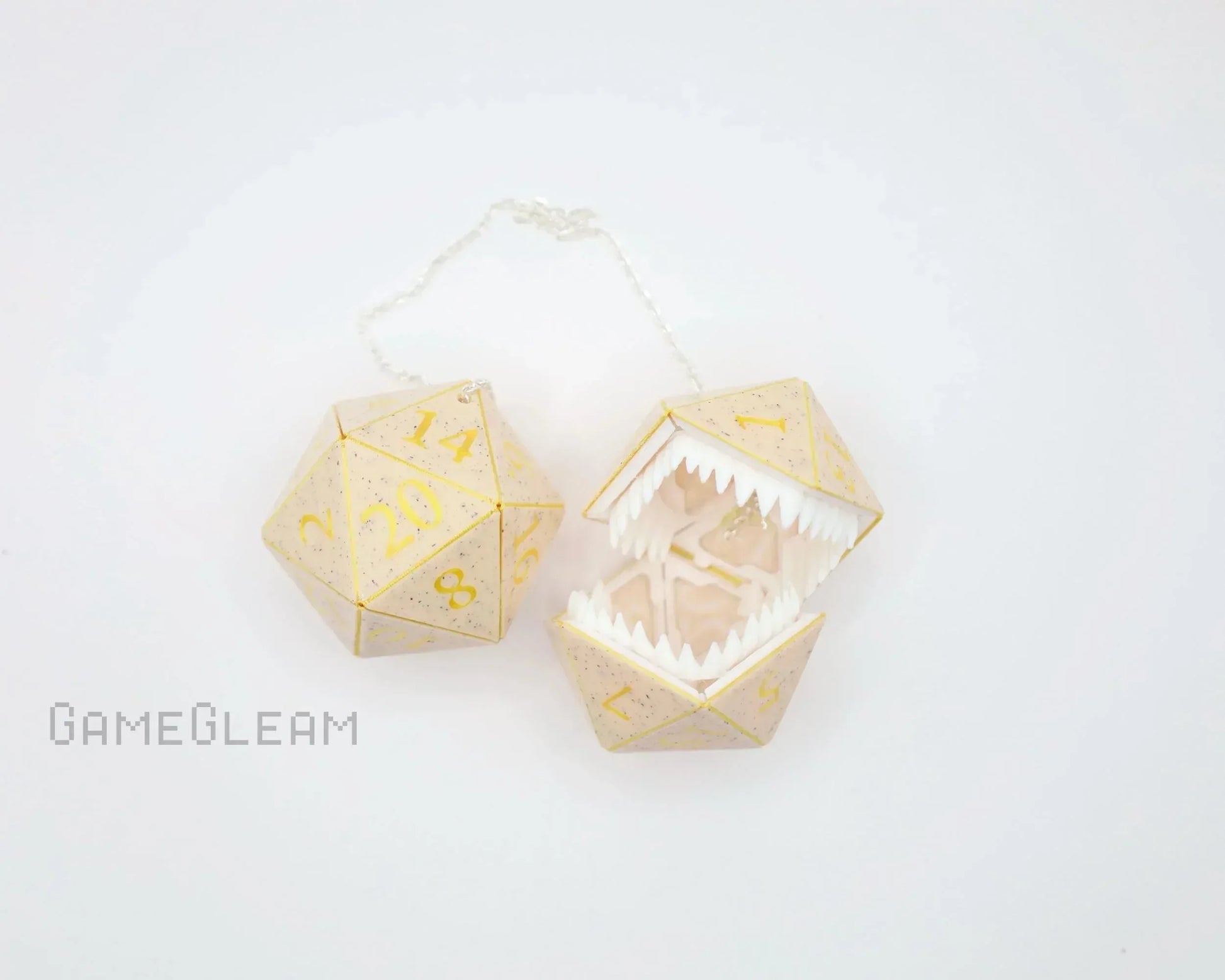 Handmade gold-speckled D20 dice charm with hinged monster mouth, geek gift accessory.