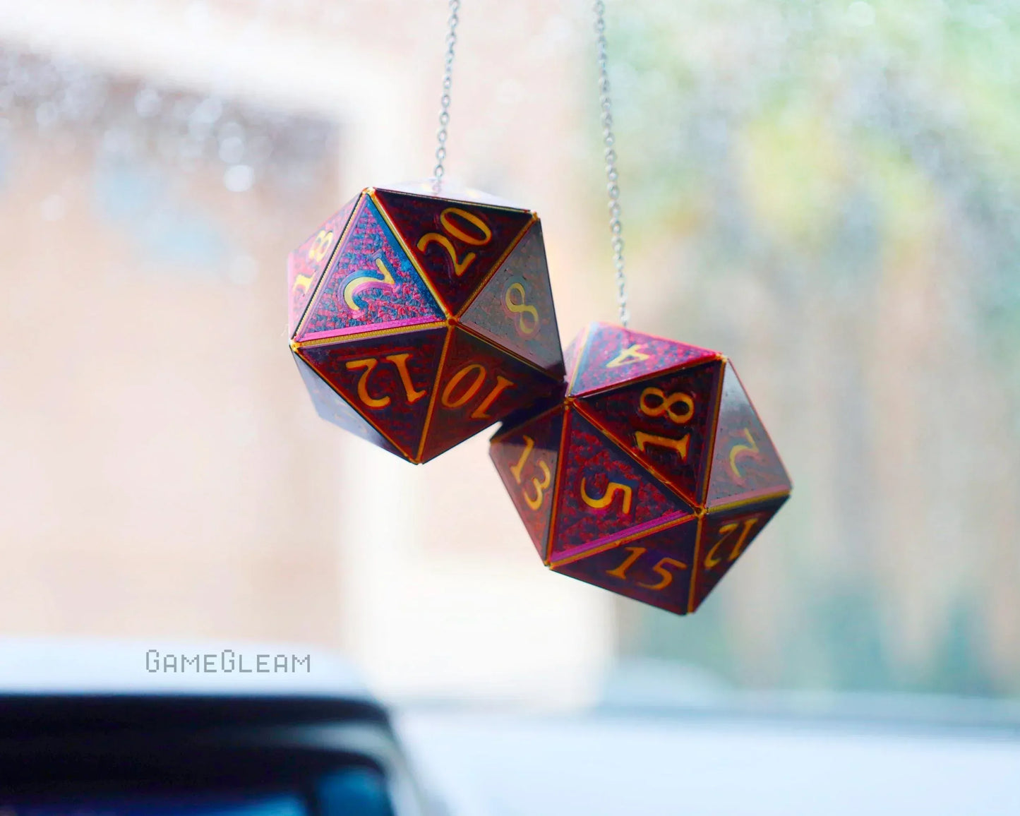Handmade holographic twenty-sided dice car charm hanging from rearview mirror