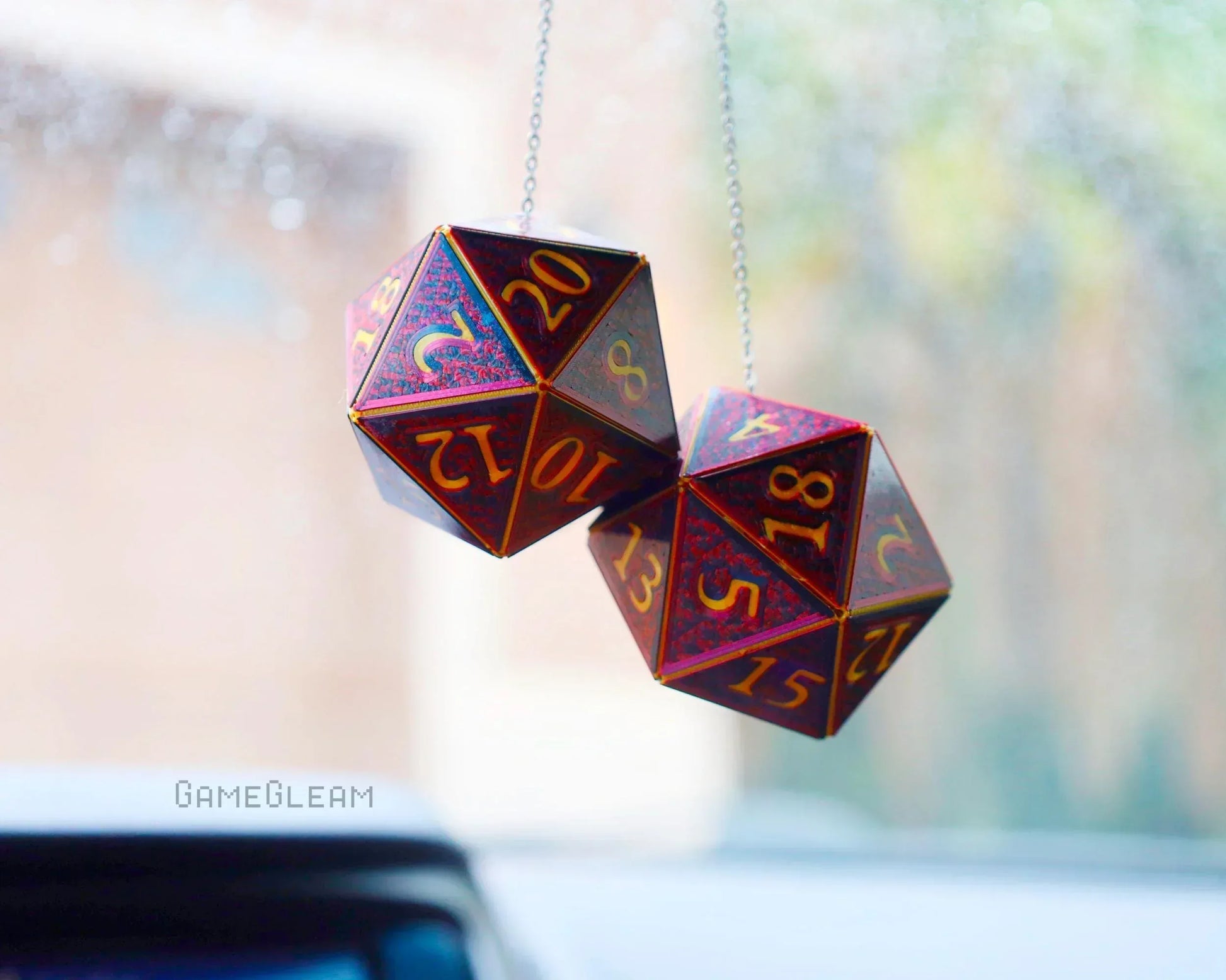 Handmade holographic twenty-sided dice car charm hanging from rearview mirror