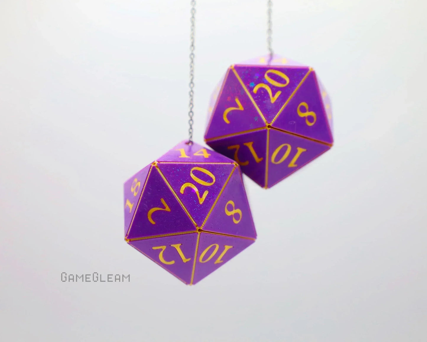 Purple 20-sided car dice charms with gold numbers hanging on chains, gamer gift accessory