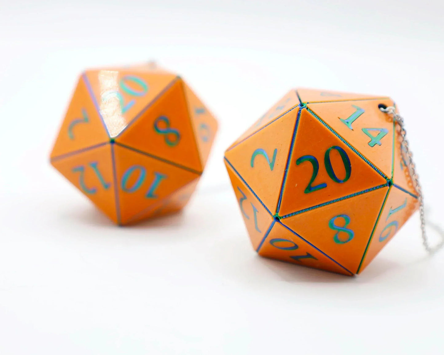 Orange twenty-sided dice with blue numbers and chain, ideal for tabletop RPG car accessories.