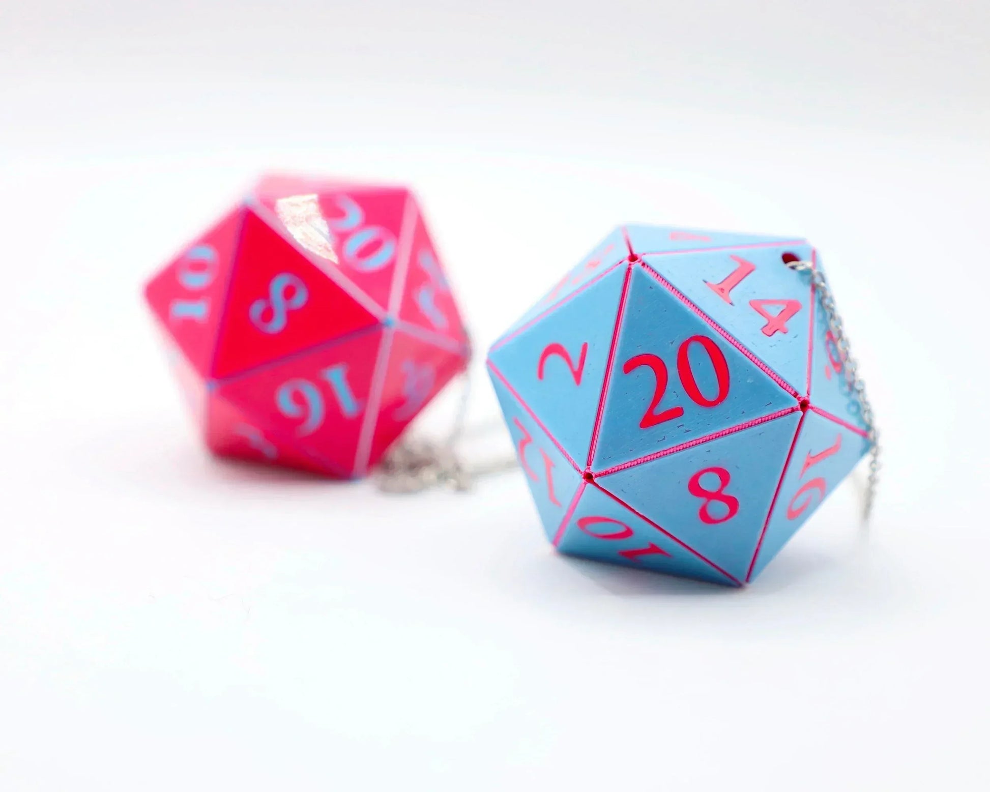 Blue and pink 20-sided dice car charms with chains for tabletop gaming enthusiasts