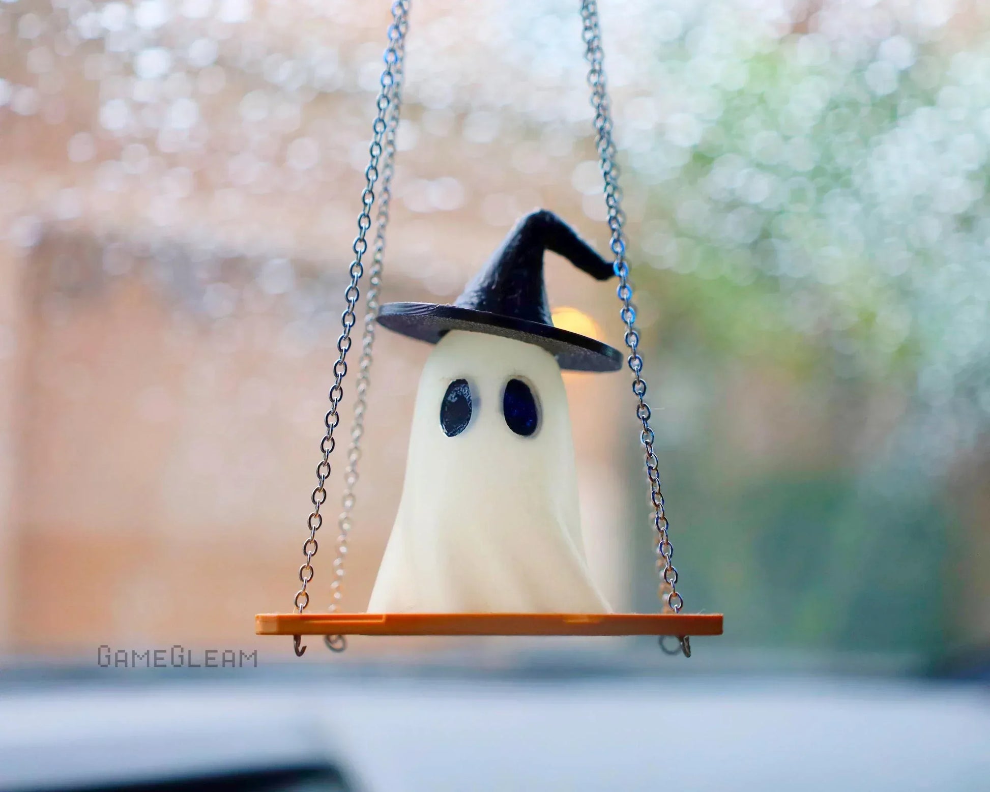 Handmade ghost car charm with witch hat on swing, hanging from rearview mirror