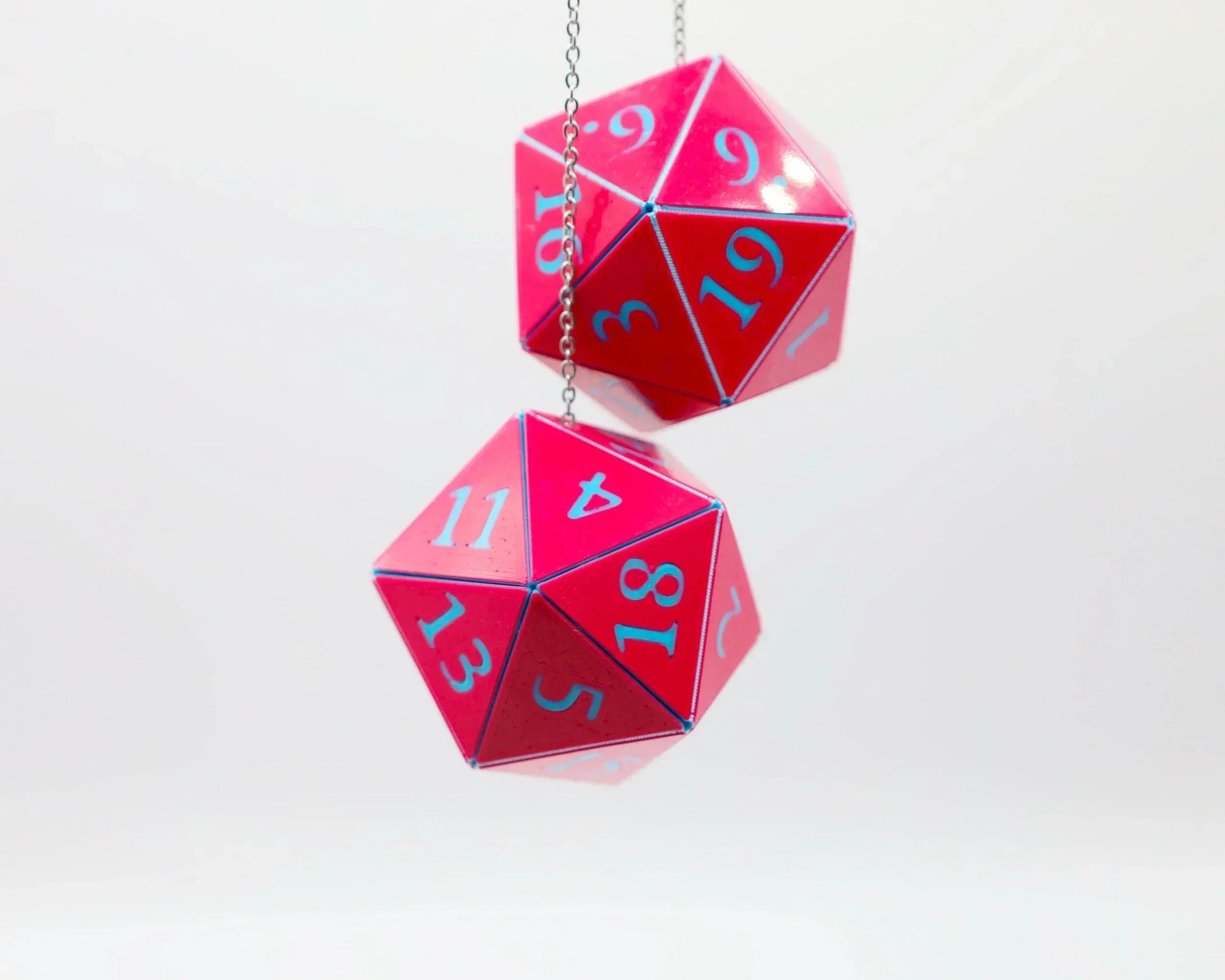 Pink holographic twenty-sided dice car charm for tabletop RPG fans, hanging on a chain.