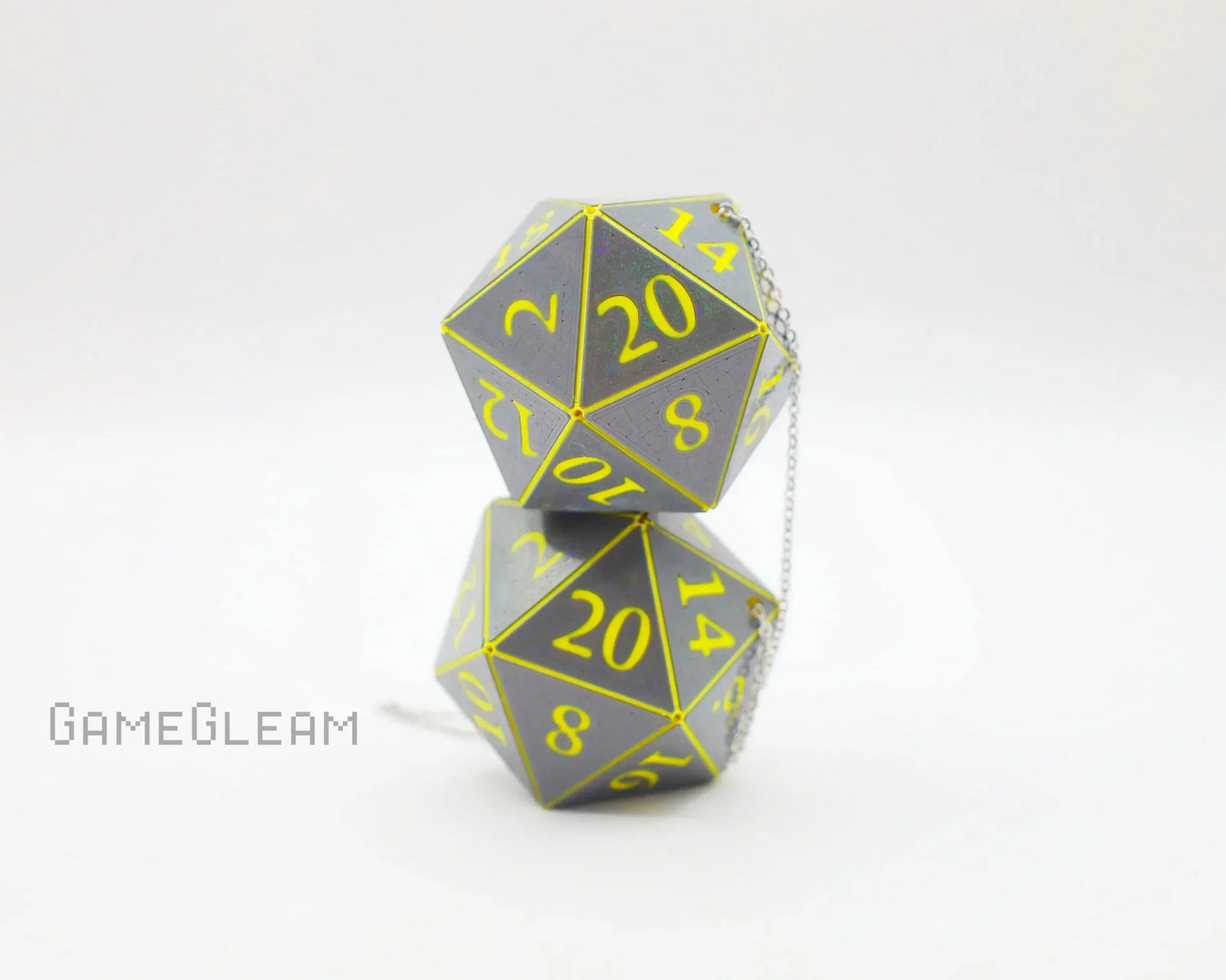 Handmade holographic twenty-sided dice car charm with yellow numbers on a silver chain.
