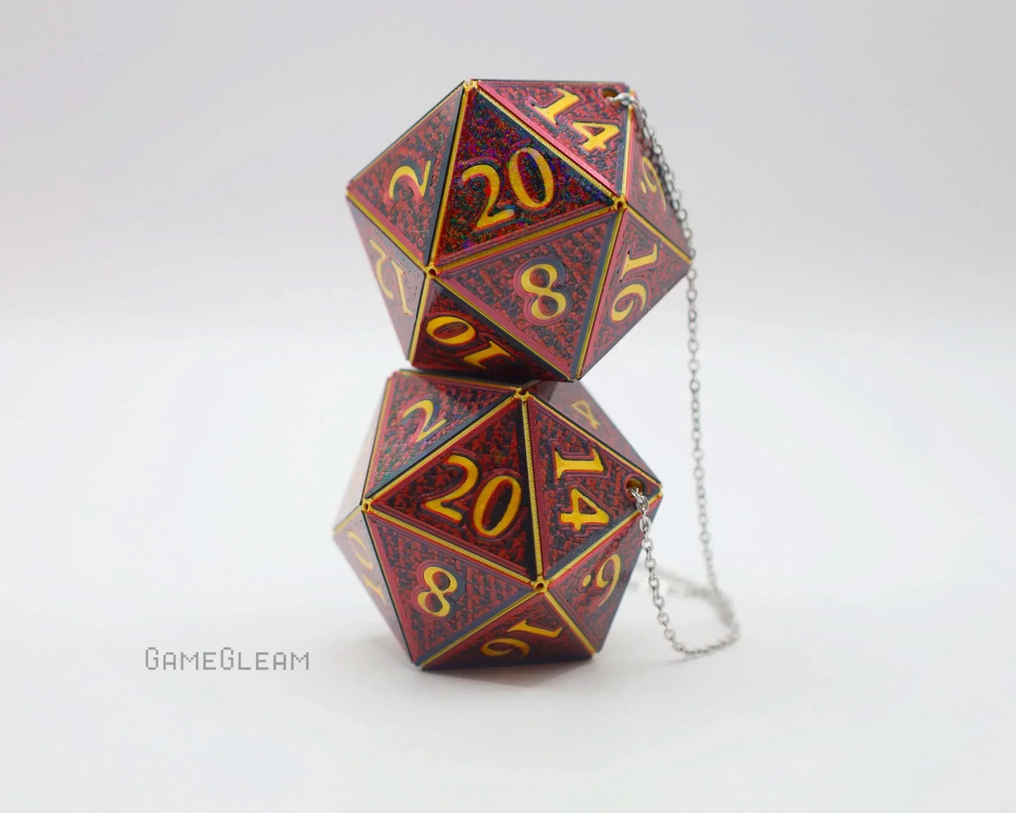 Pair of red holographic twenty-sided dice car charms with gold numbers and chain