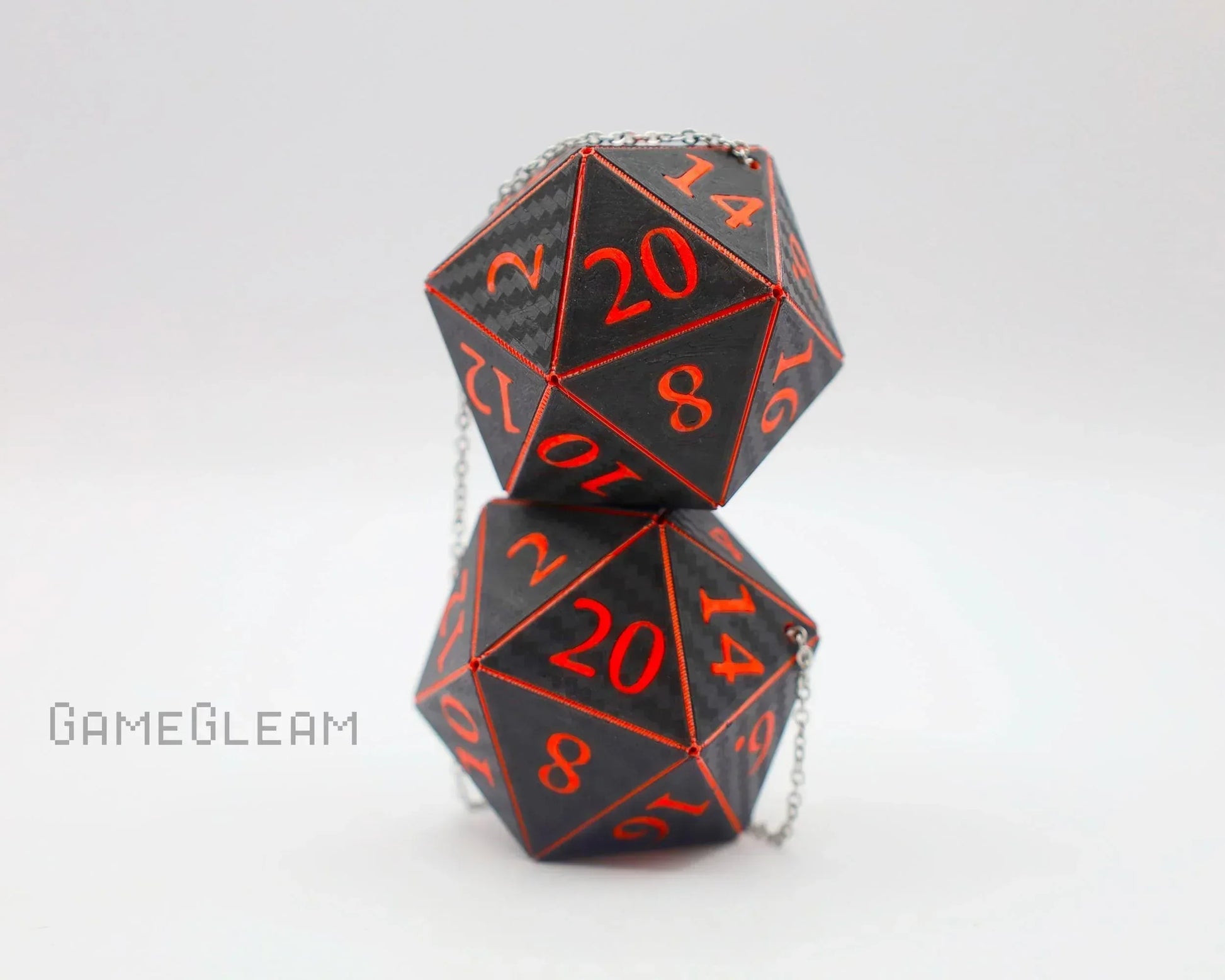 Handmade carbon fiber effect D20 dice charms with red numbers and silver chain for car decor.