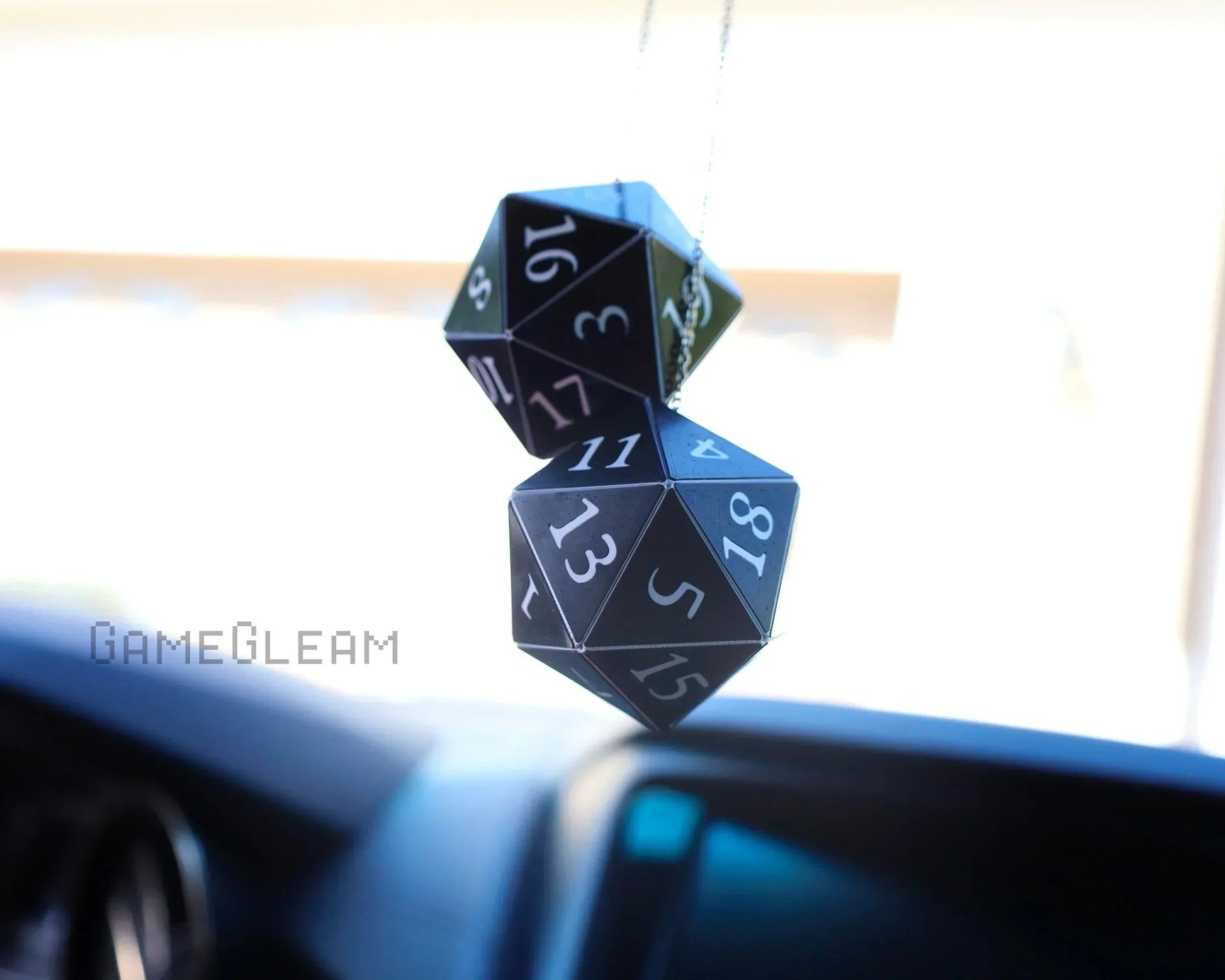 Black twenty-sided dice car charm hanging from rearview mirror, RPG gamer accessory