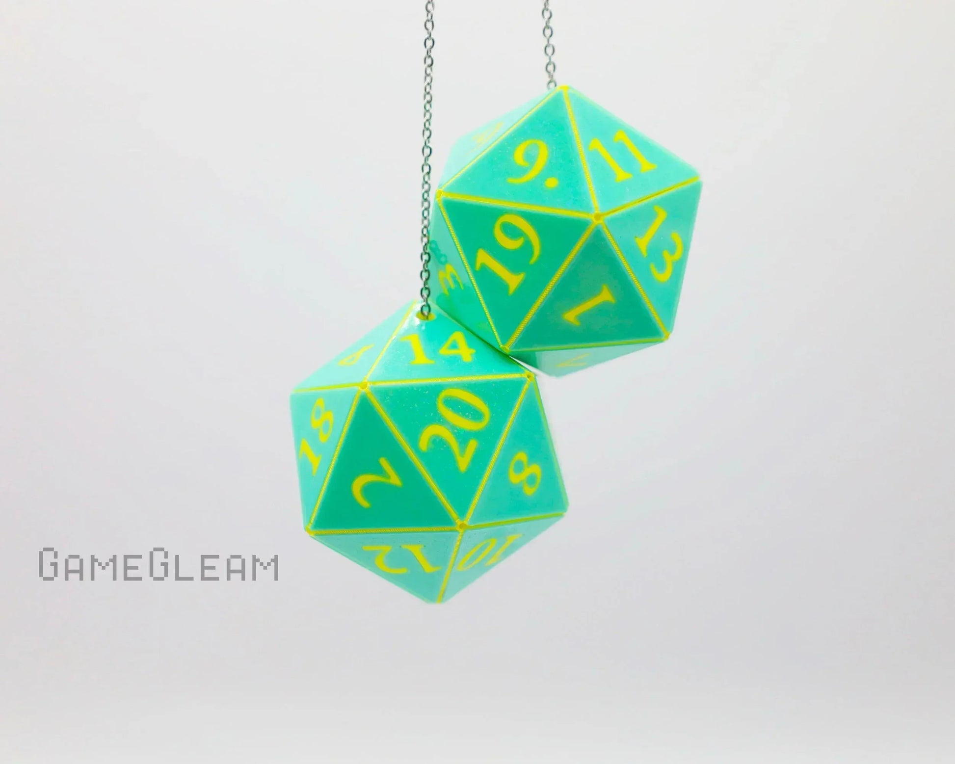 Pair of teal twenty-sided dice car charms with yellow numbers hanging on a chain.