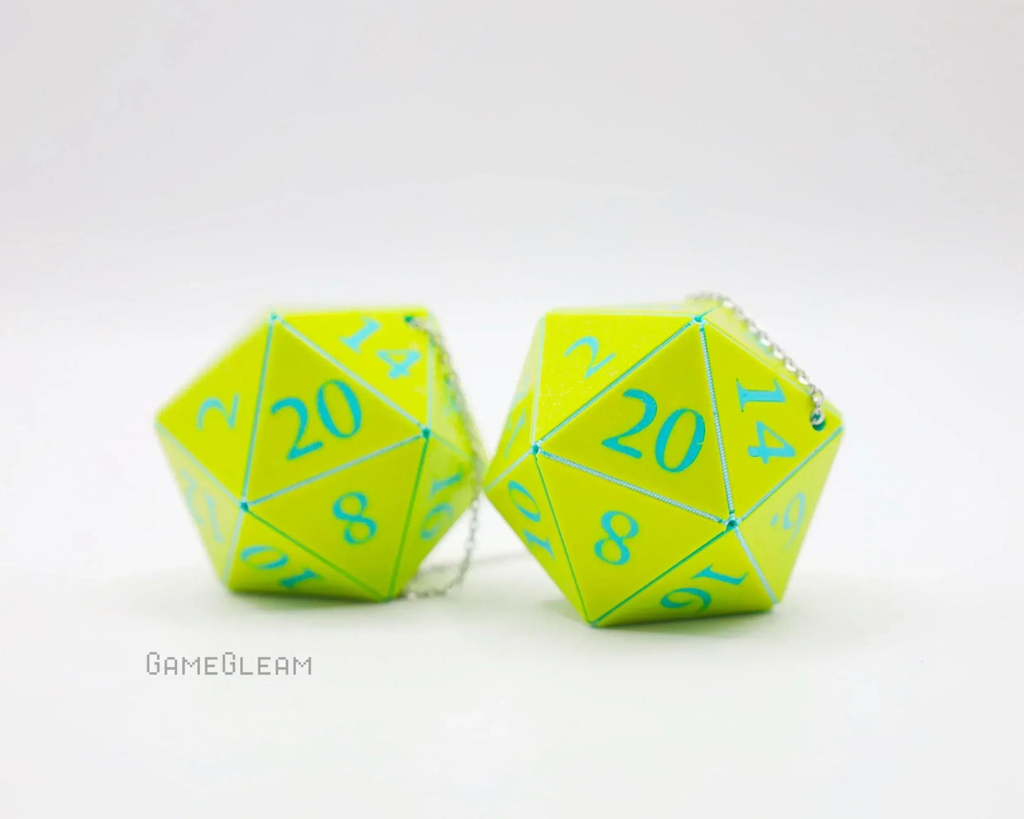 Pair of neon yellow twenty-sided dice with blue numbers and silver chain for car accessory