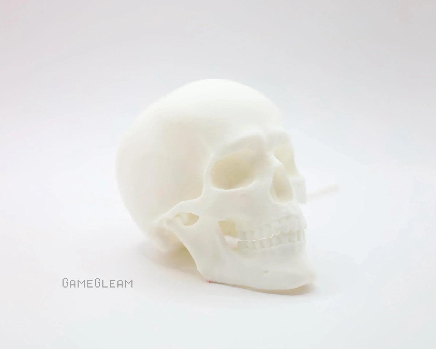 White resin skull decor on white background, minimalist handmade gamer accessory