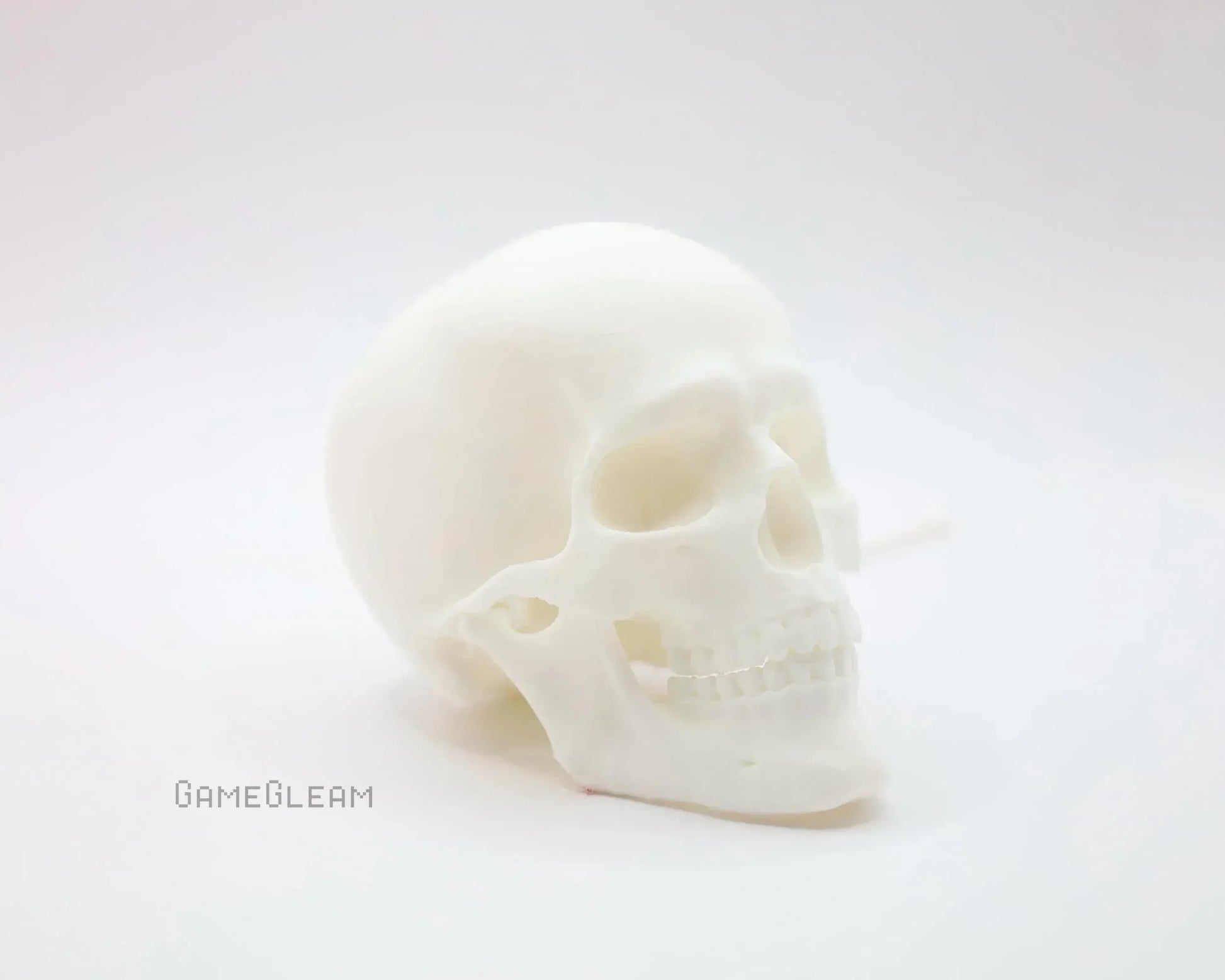 White resin skull decor on white background, minimalist handmade gamer accessory