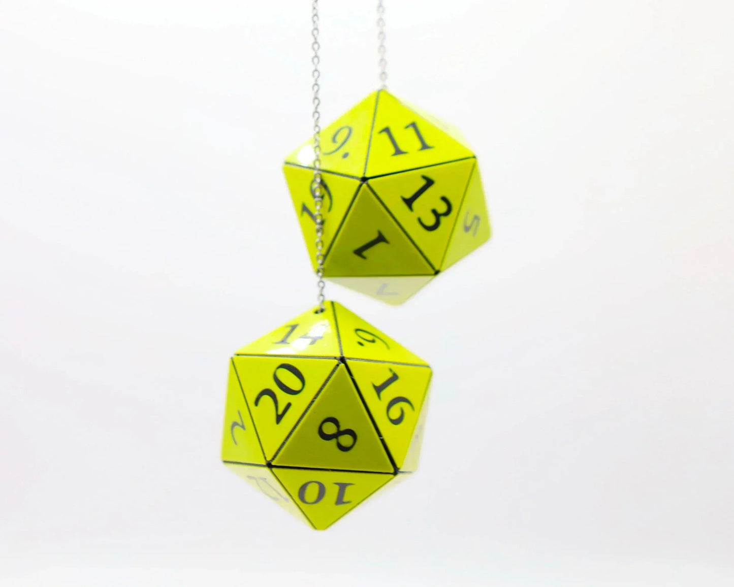 Pair of yellow 20-sided dice car charms with black numbers hanging on chains