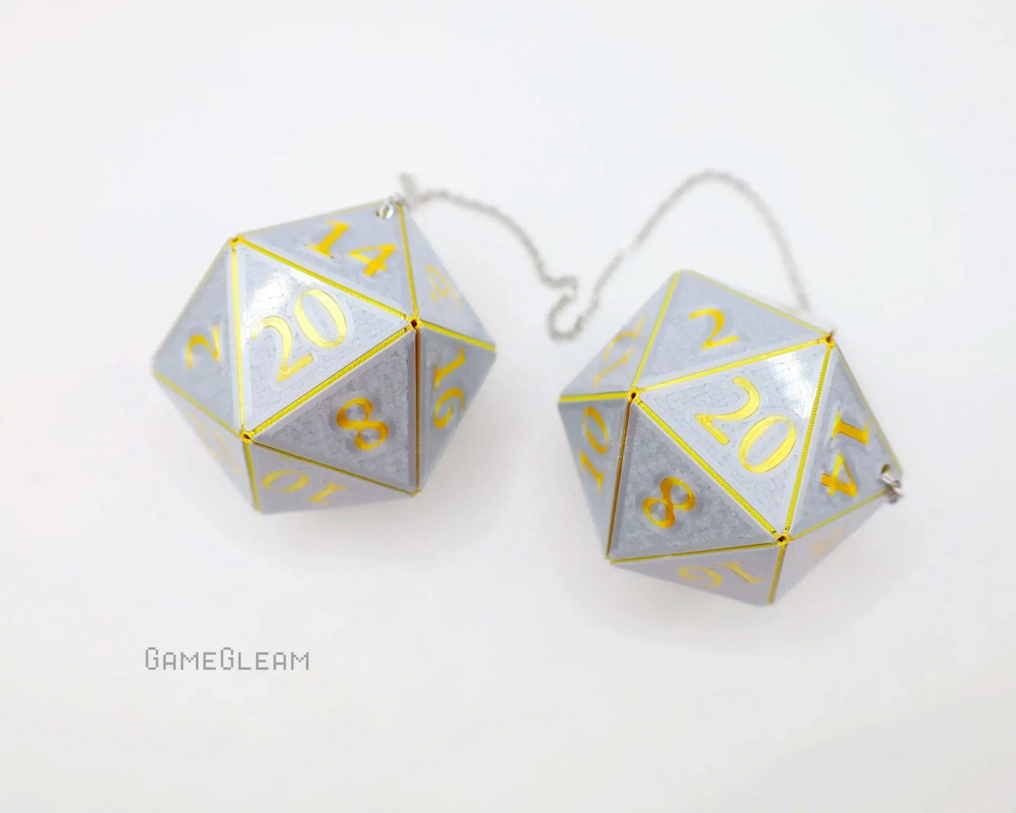 Pair of holographic silver twenty-sided dice car charms with gold numbers and chain