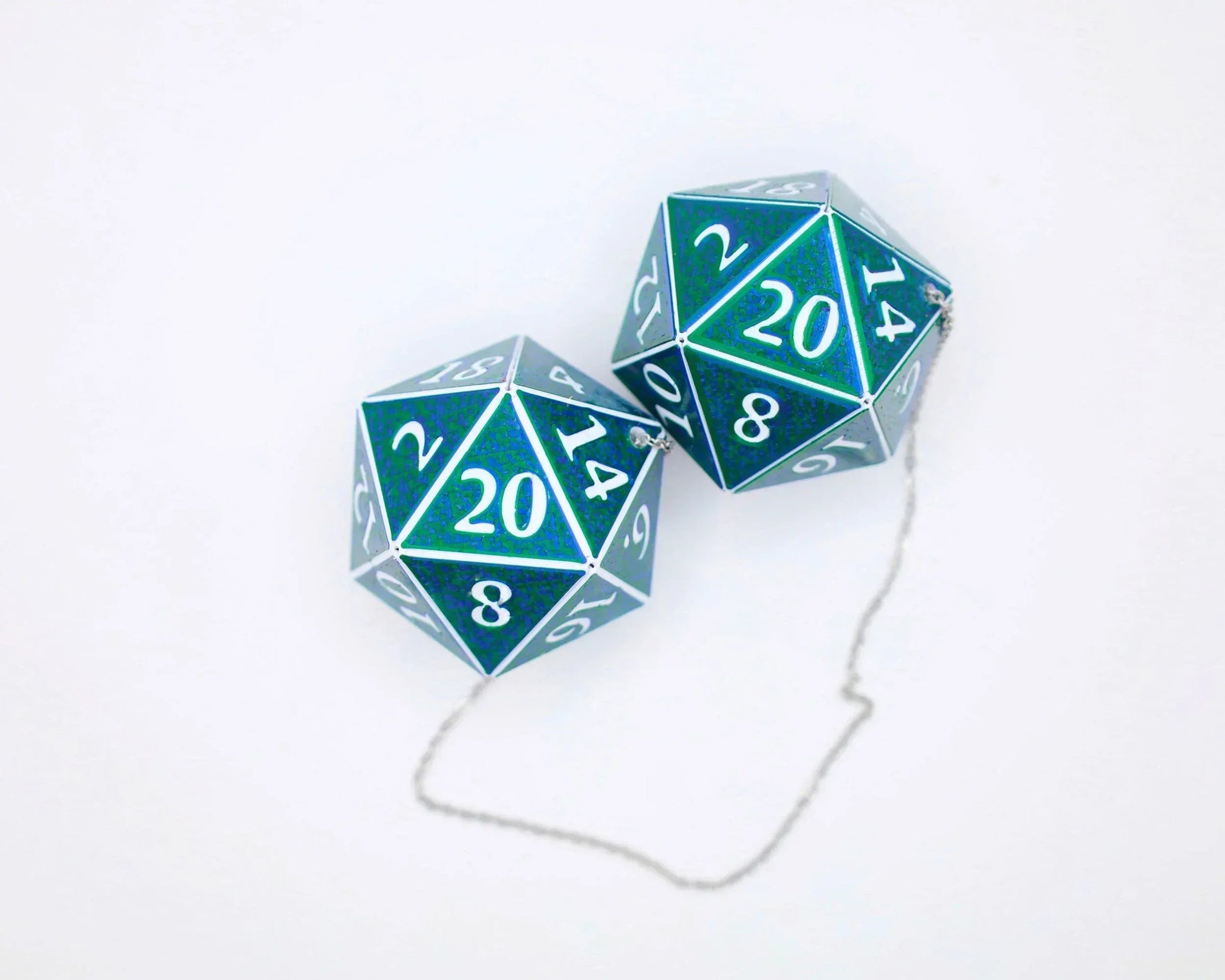 Holographic green twenty-sided dice car charm with white numbers on a silver chain