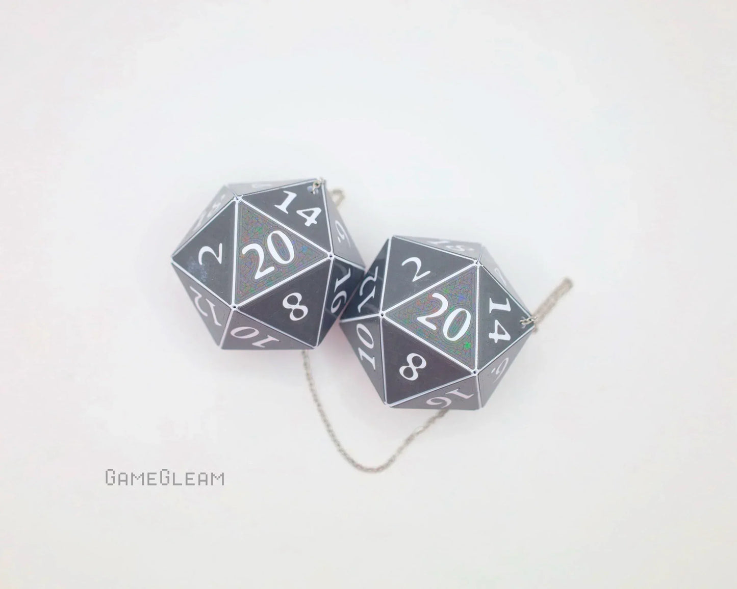 Holographic twenty-sided dice car charm pair with white numbers on a chain, gamer gift accessory