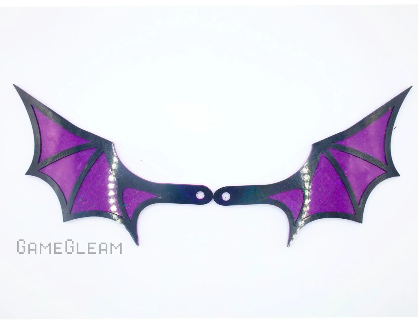Handmade purple and black bat wings car accessory with iridescent accents on white background