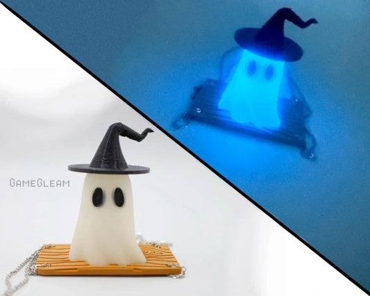 Handmade ghost car charm with witch hat, glowing blue in the dark, on chain