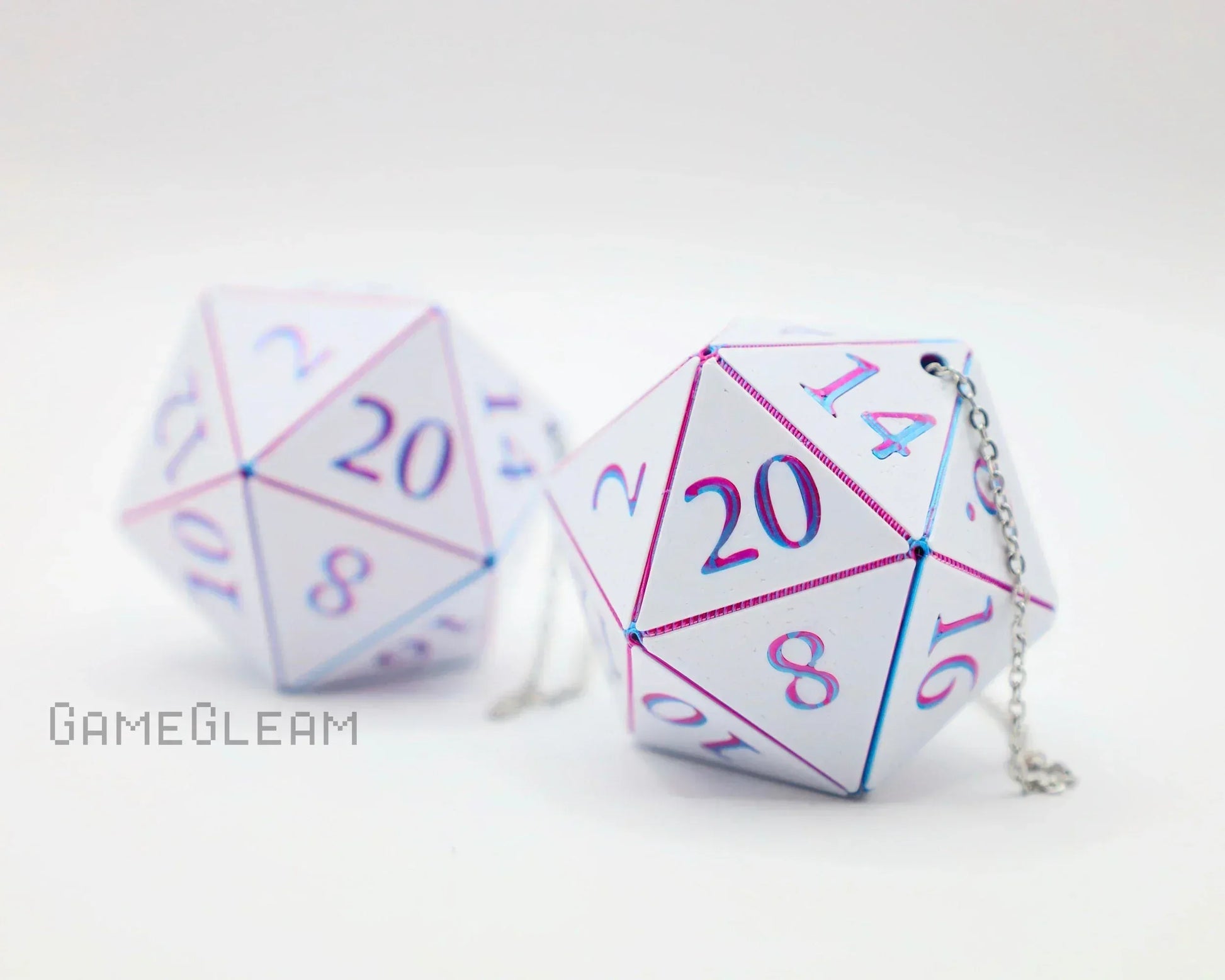 Pair of white holographic twenty-sided dice car charms with pink and blue numbers and chain