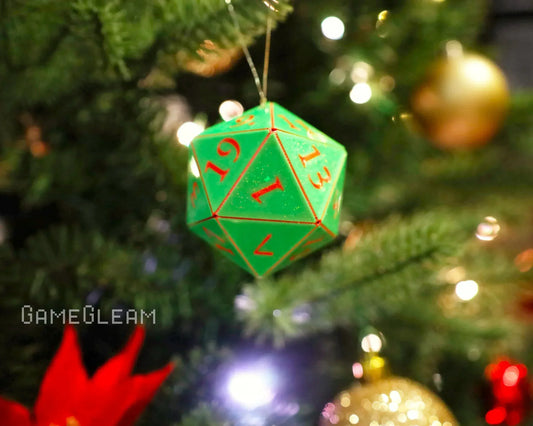 Green twenty-sided dice ornament with red numbers hanging on a decorated Christmas tree.