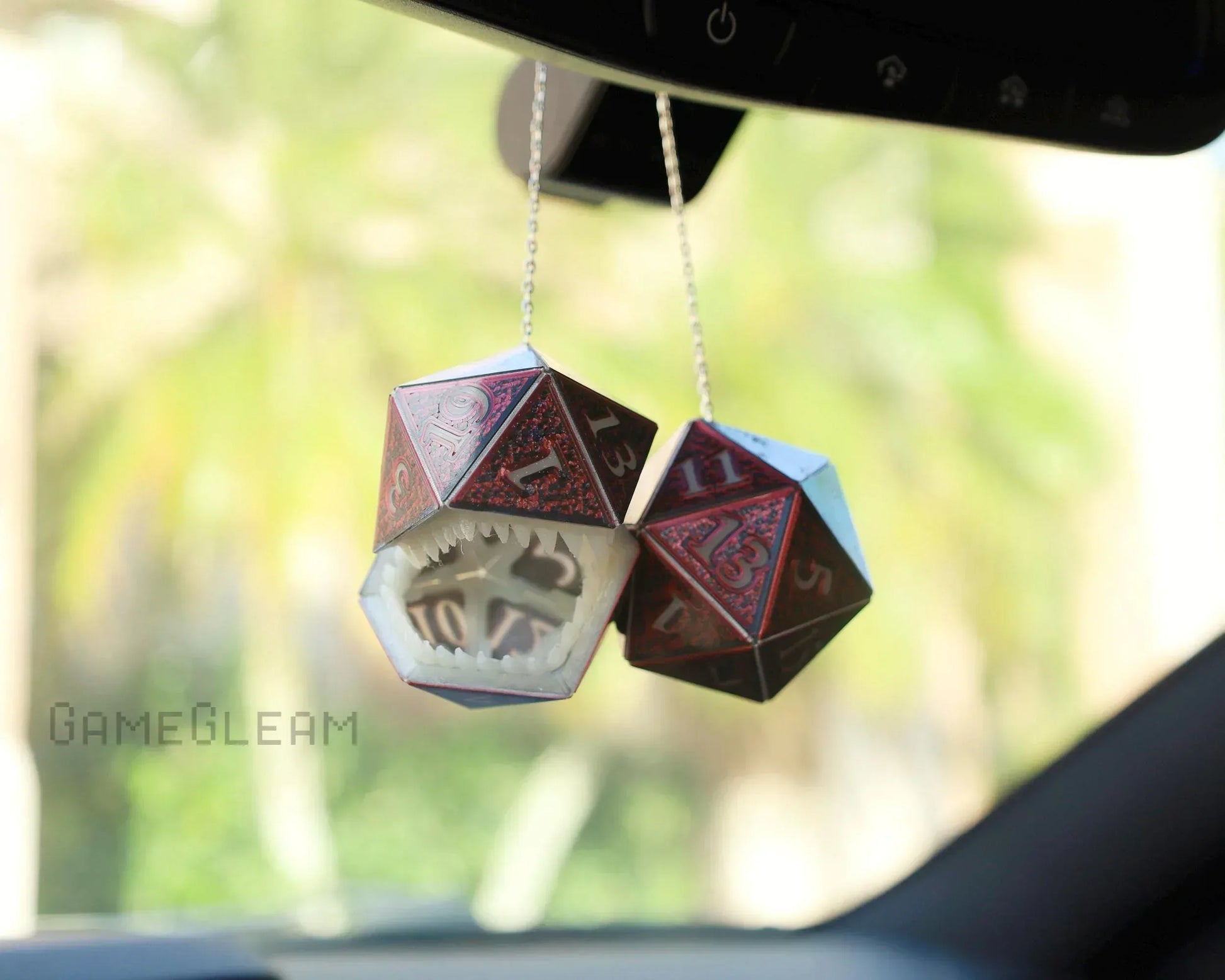 Hanging red and black twenty-sided dice car charm with a monster mouth design for RPG fans.